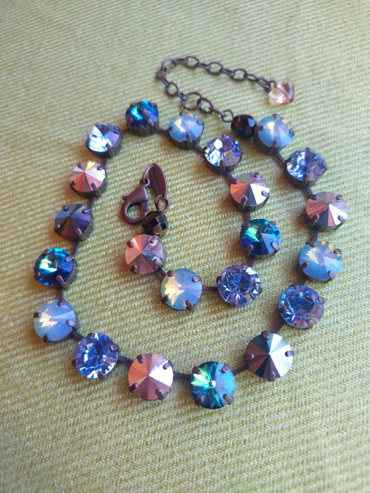 Soulful blue Sabika necklace features violet, midnight blue, opal, metallic