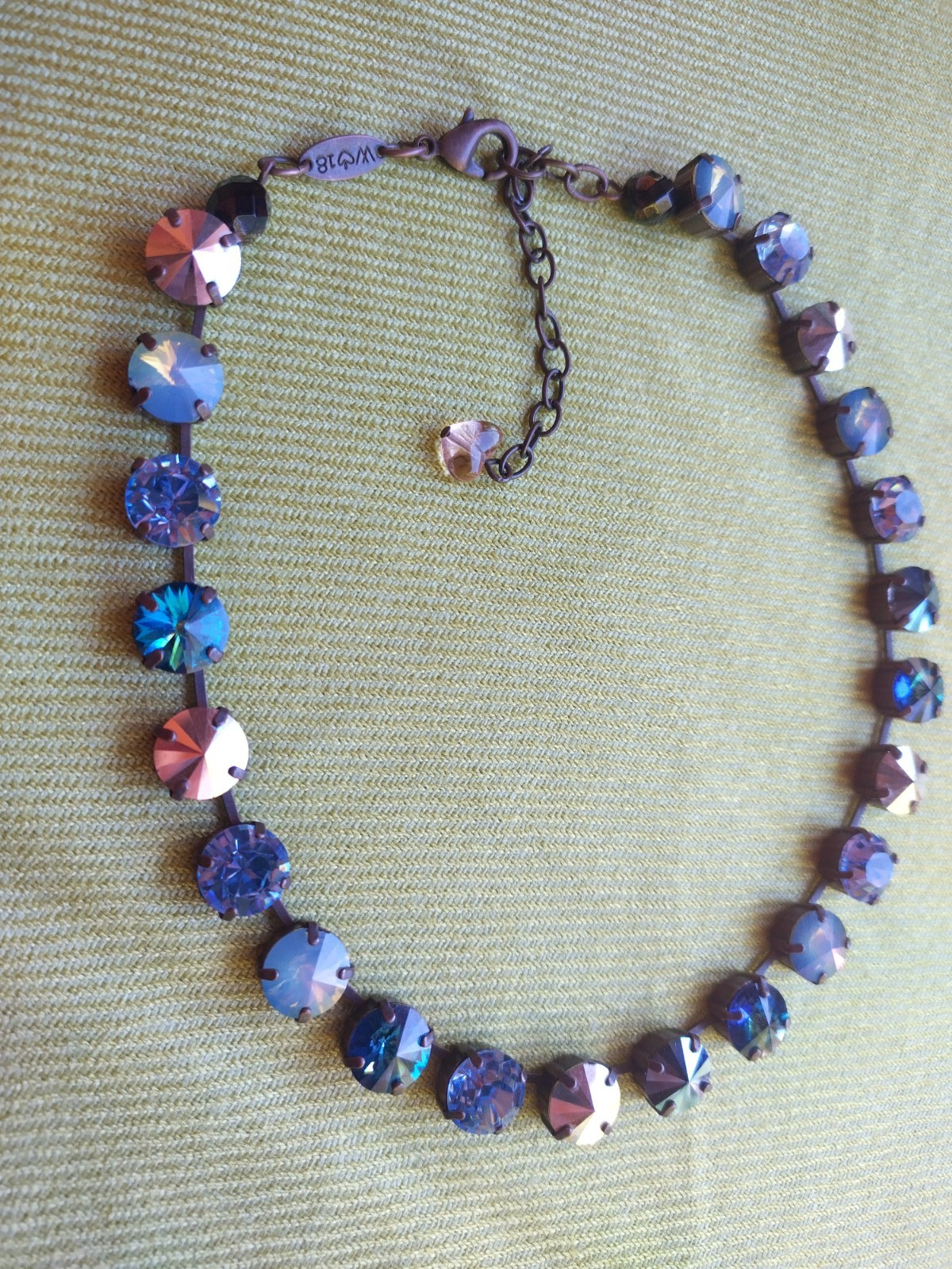 Soulful blue Sabika necklace features violet, midnight blue, opal, metallic