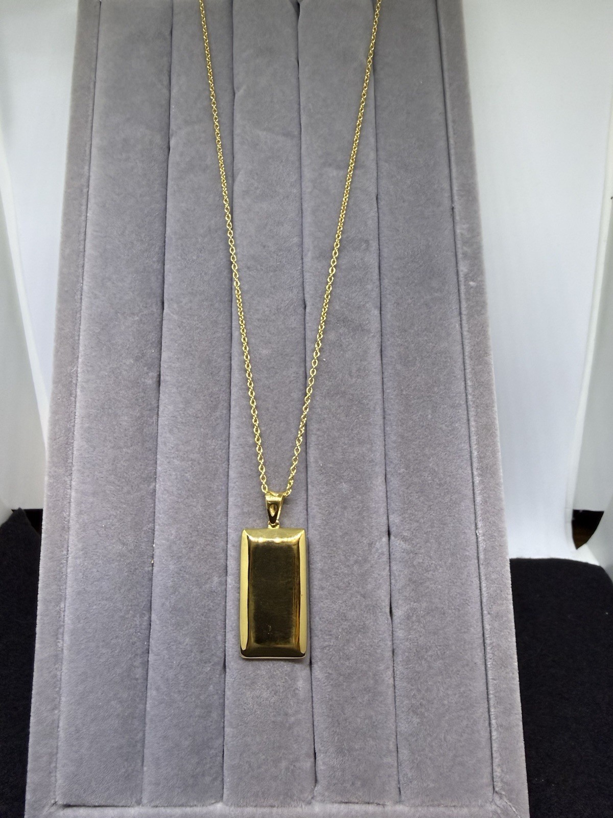 Gold Color St. Steel Bar Pendant On A 20 In. St. St. Chn. Pend. Is 1 By 1/2 In