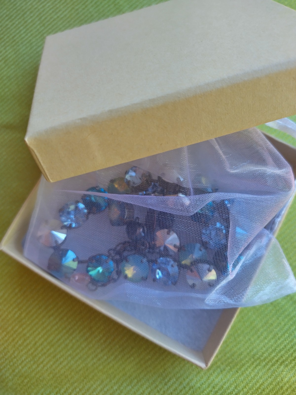 Soulful blue Sabika necklace features violet, midnight blue, opal, metallic