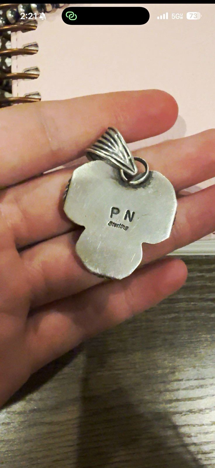 Stamped native pendant. Golden hills, while buffalo, and pink conch turquoise.