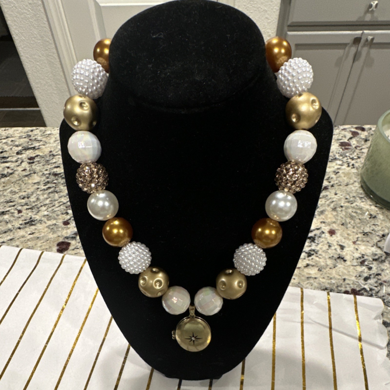 Gold Tone Beaded Necklace with Oval Locket Pendant, White Plastic Metal