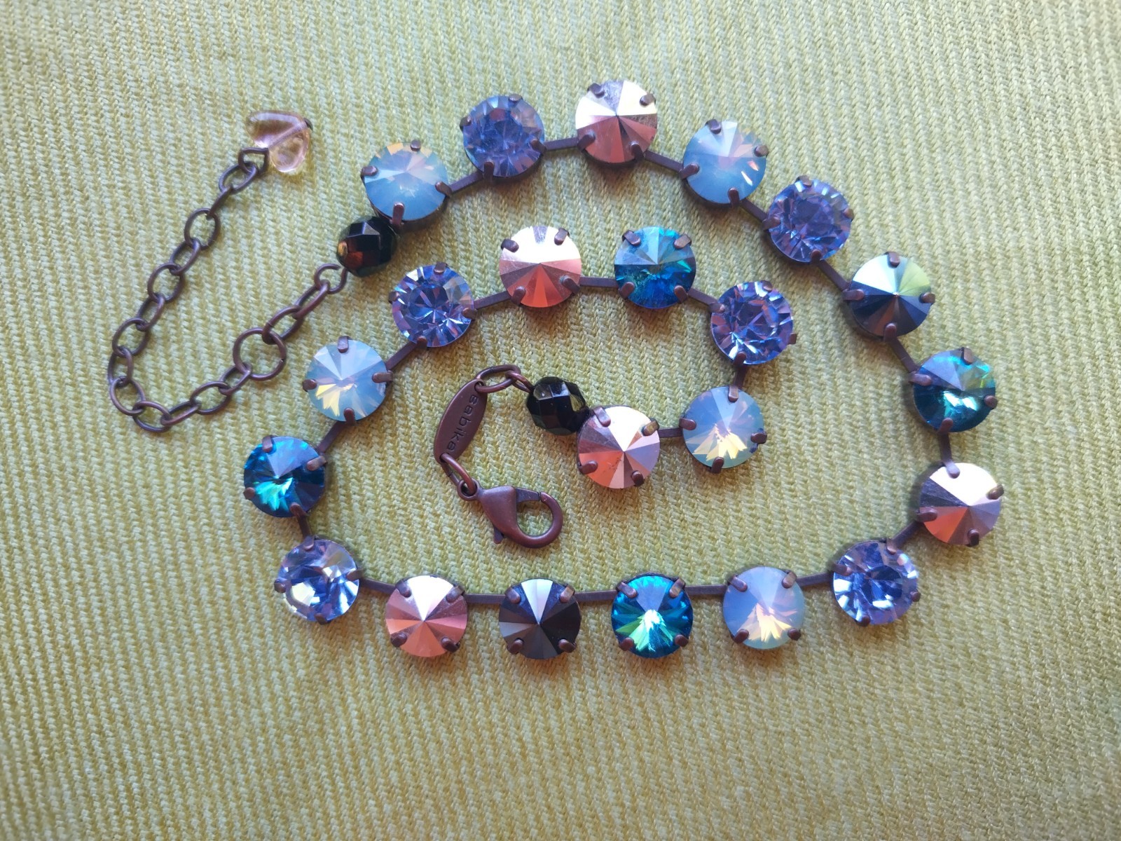 Soulful blue Sabika necklace features violet, midnight blue, opal, metallic