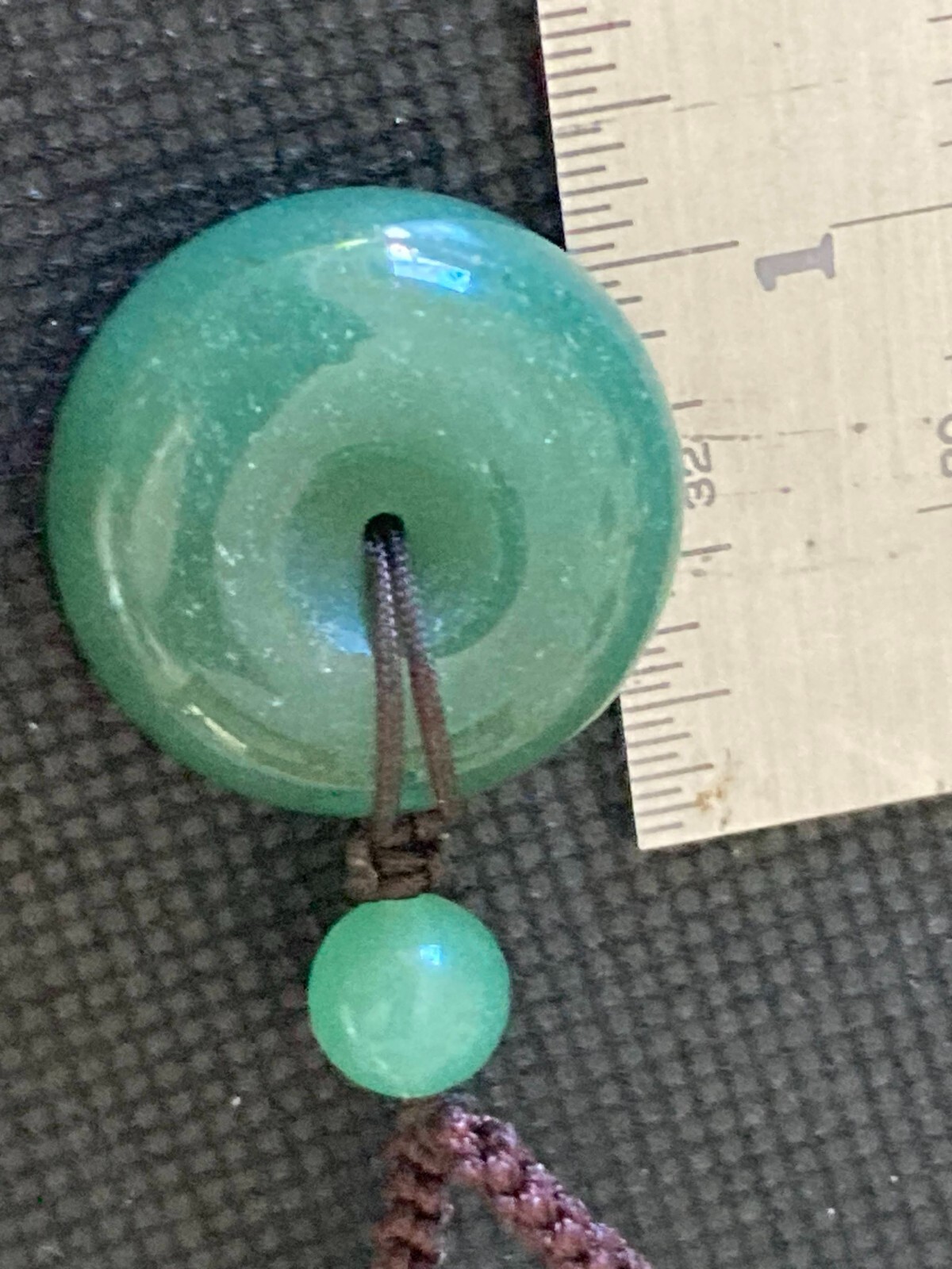 Necklace Carved Green Stone Pendant Circle and 3 stone beads woven with cord