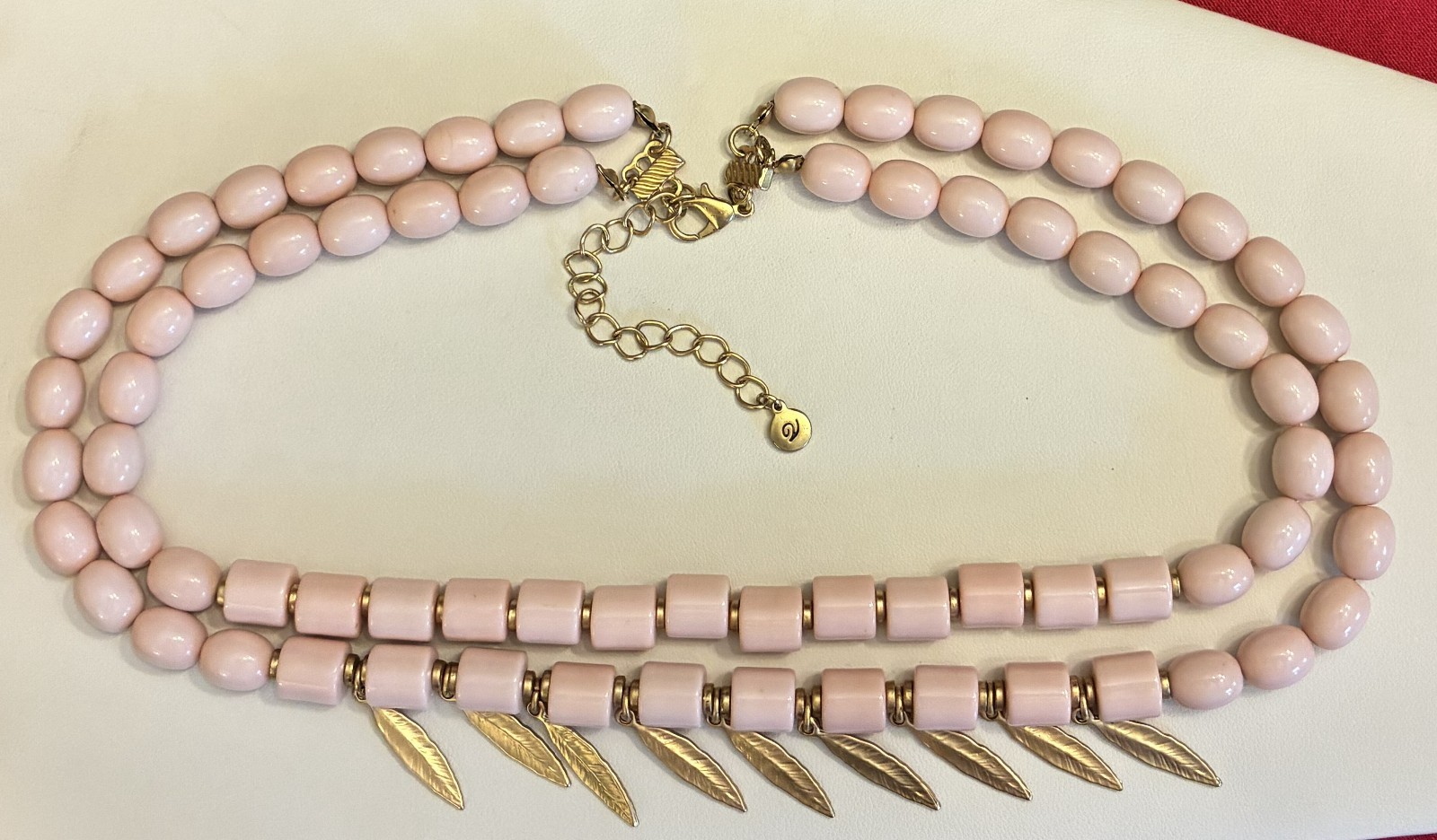 Versona Light Pink Bead Necklace with Attached Gold Tone Feather Accents