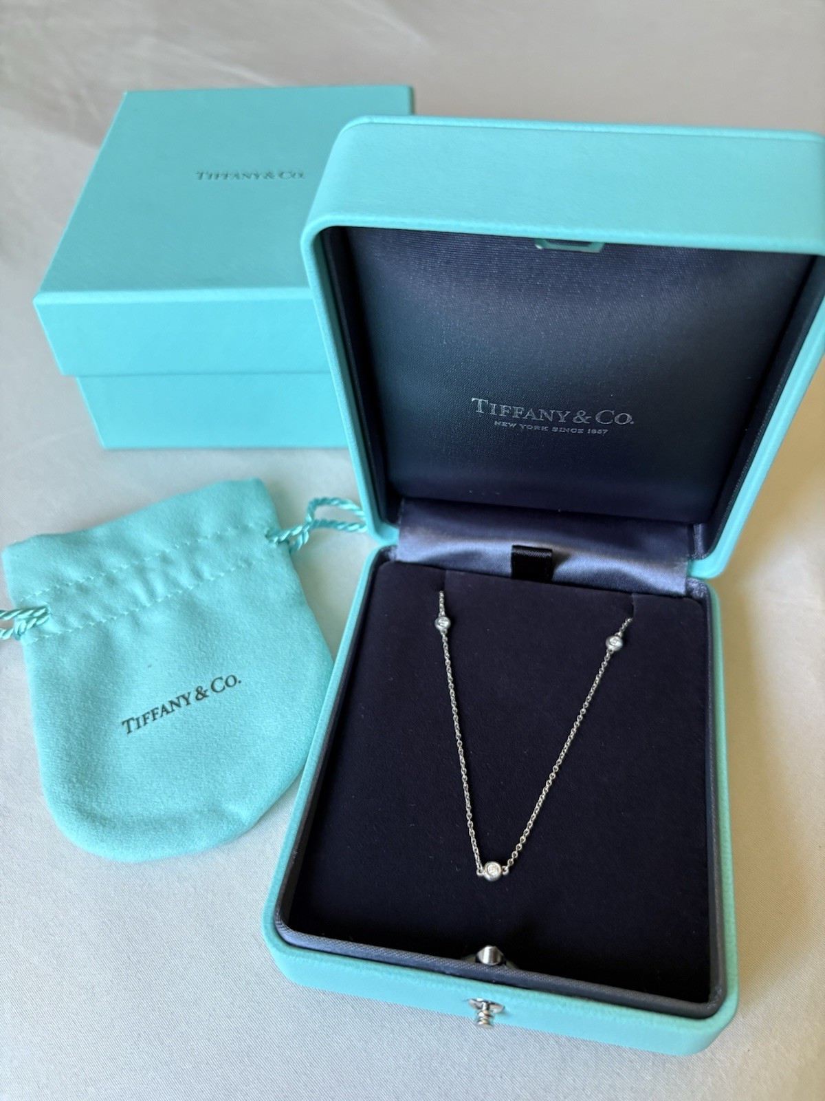 Authentic Tiffany & Co. Three round natural diamonds Necklace. NEW