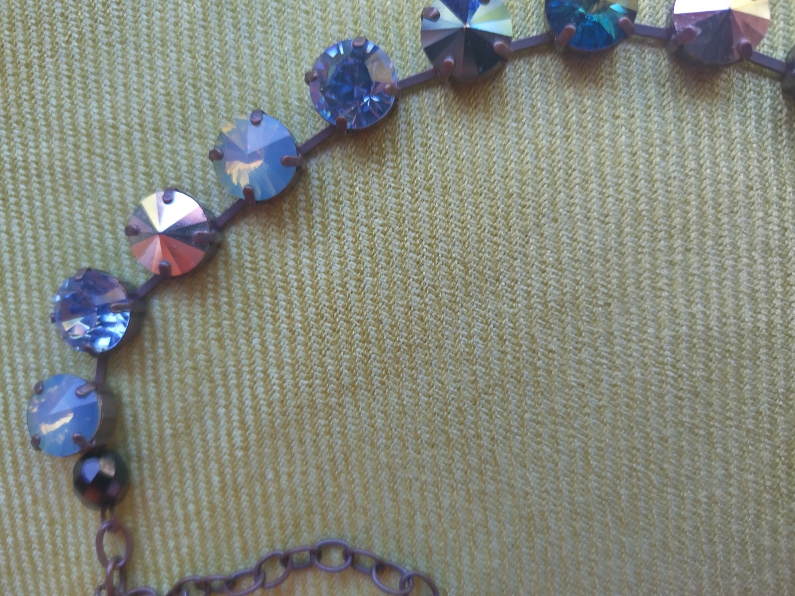Soulful blue Sabika necklace features violet, midnight blue, opal, metallic