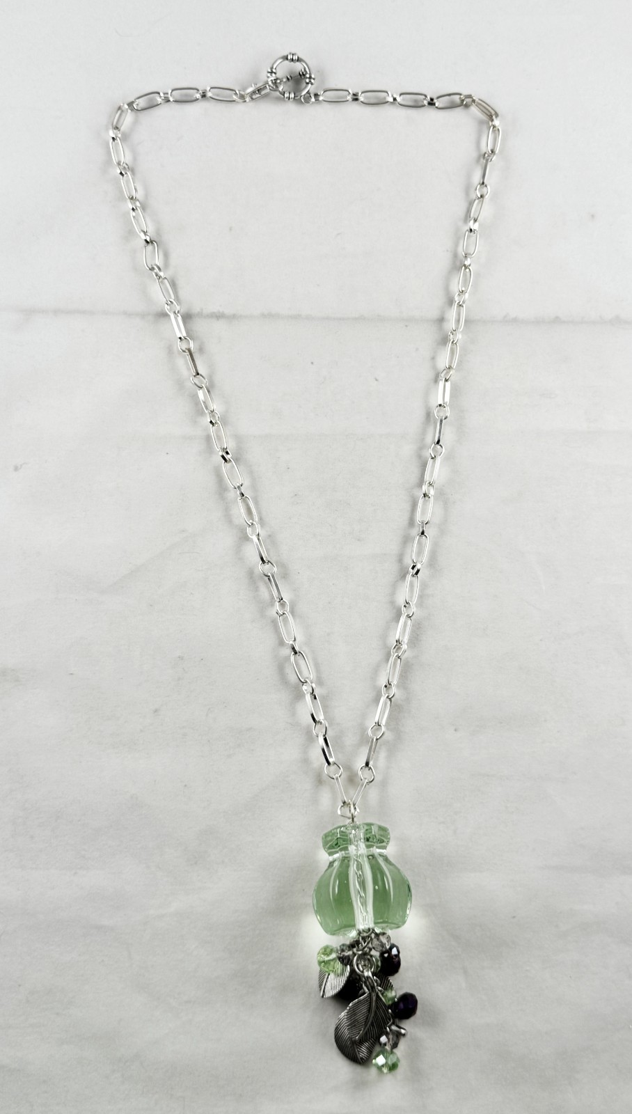 Silver tone long necklace, large mint green Lucite bead, crystal and leaf dangle