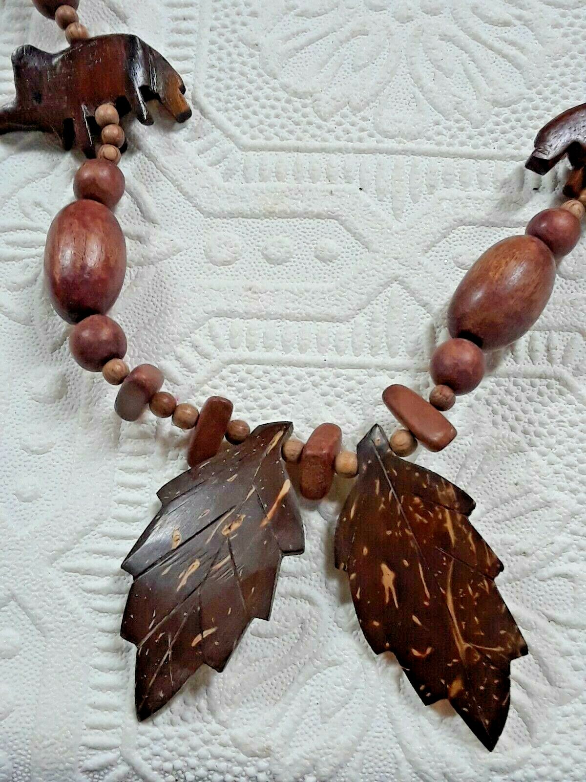 wooden beaded necklaces and one with earrings. elephants, leaves, colorful beads