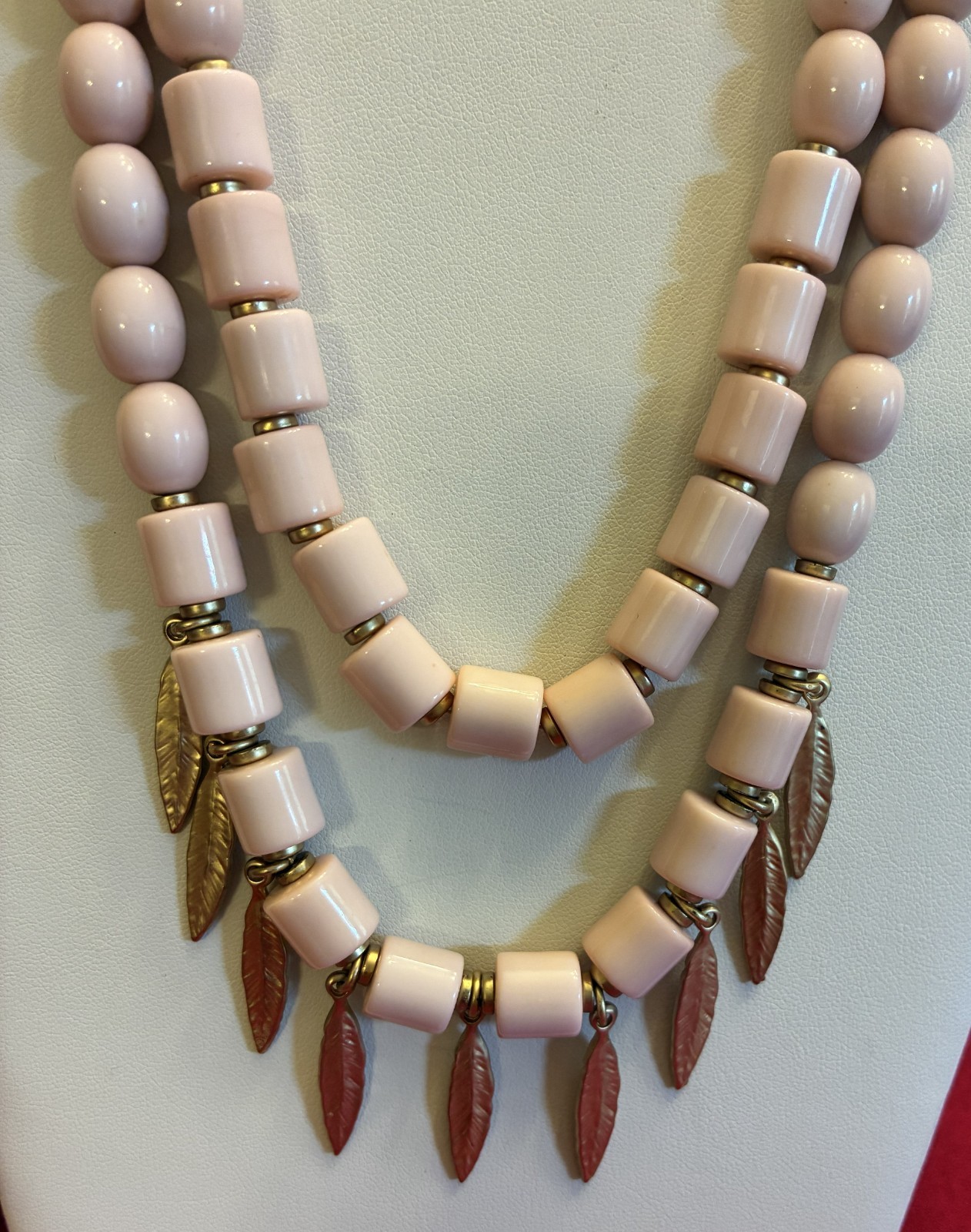 Versona Light Pink Bead Necklace with Attached Gold Tone Feather Accents