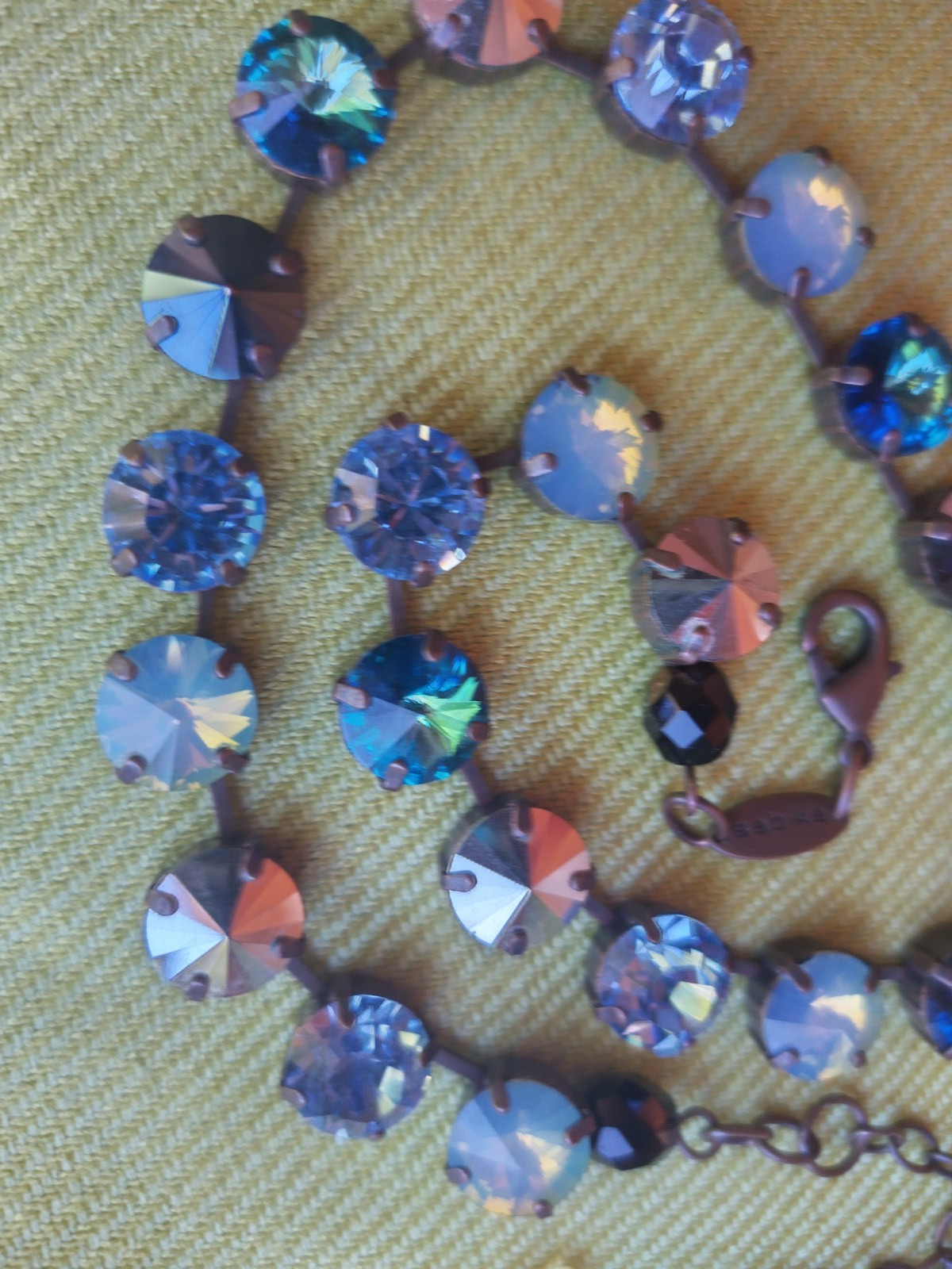 Soulful blue Sabika necklace features violet, midnight blue, opal, metallic