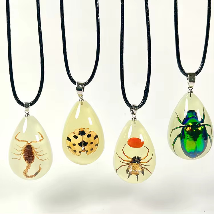 Glow in the dark bug necklaces in resin