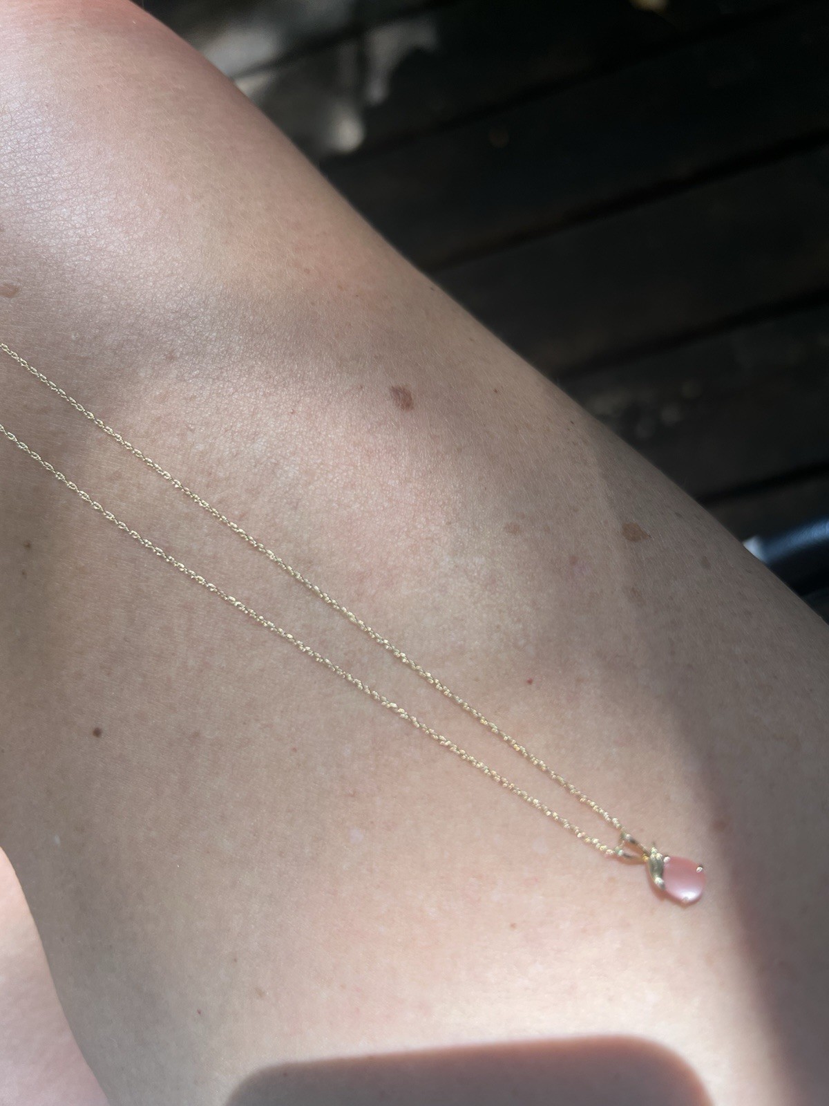 Pear shaped rose quartz set in 14k gold pendant with 14k gold 1.5 mm twist chain