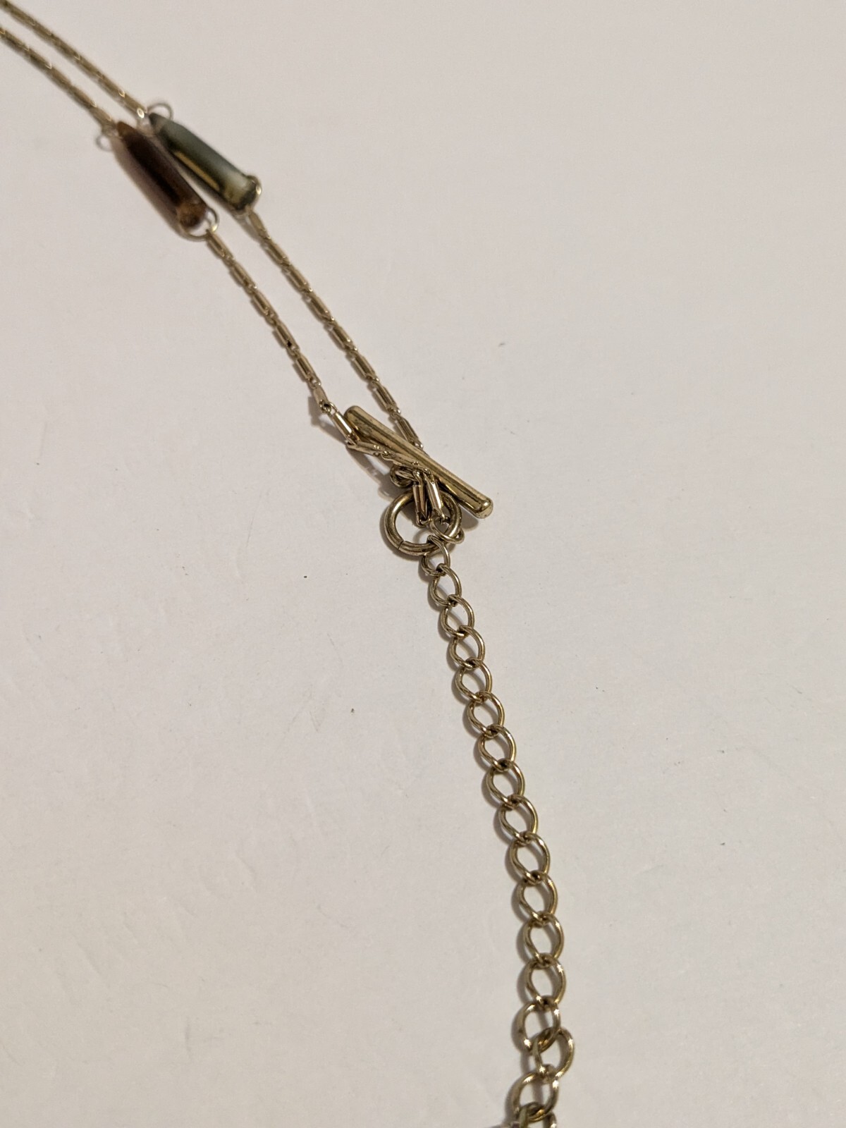 Gold Tone Y Drop Necklace With Acrylic Spear Shaped Beads. 28″ + 6.25″ Drop.