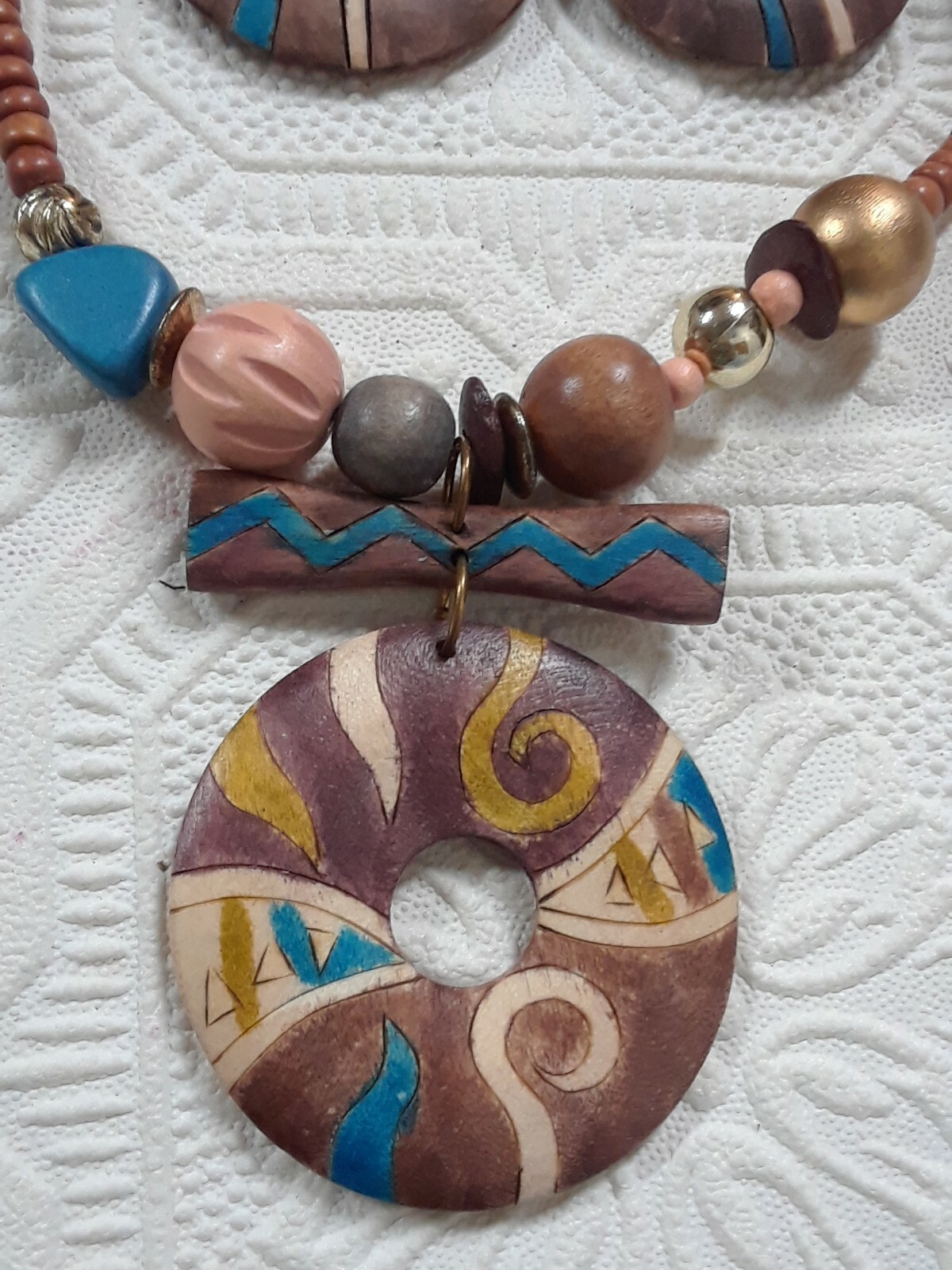wooden beaded necklaces and one with earrings. elephants, leaves, colorful beads