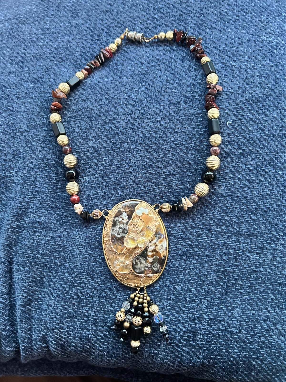 Real stone beads and stone chip necklace with gold and black pendant
