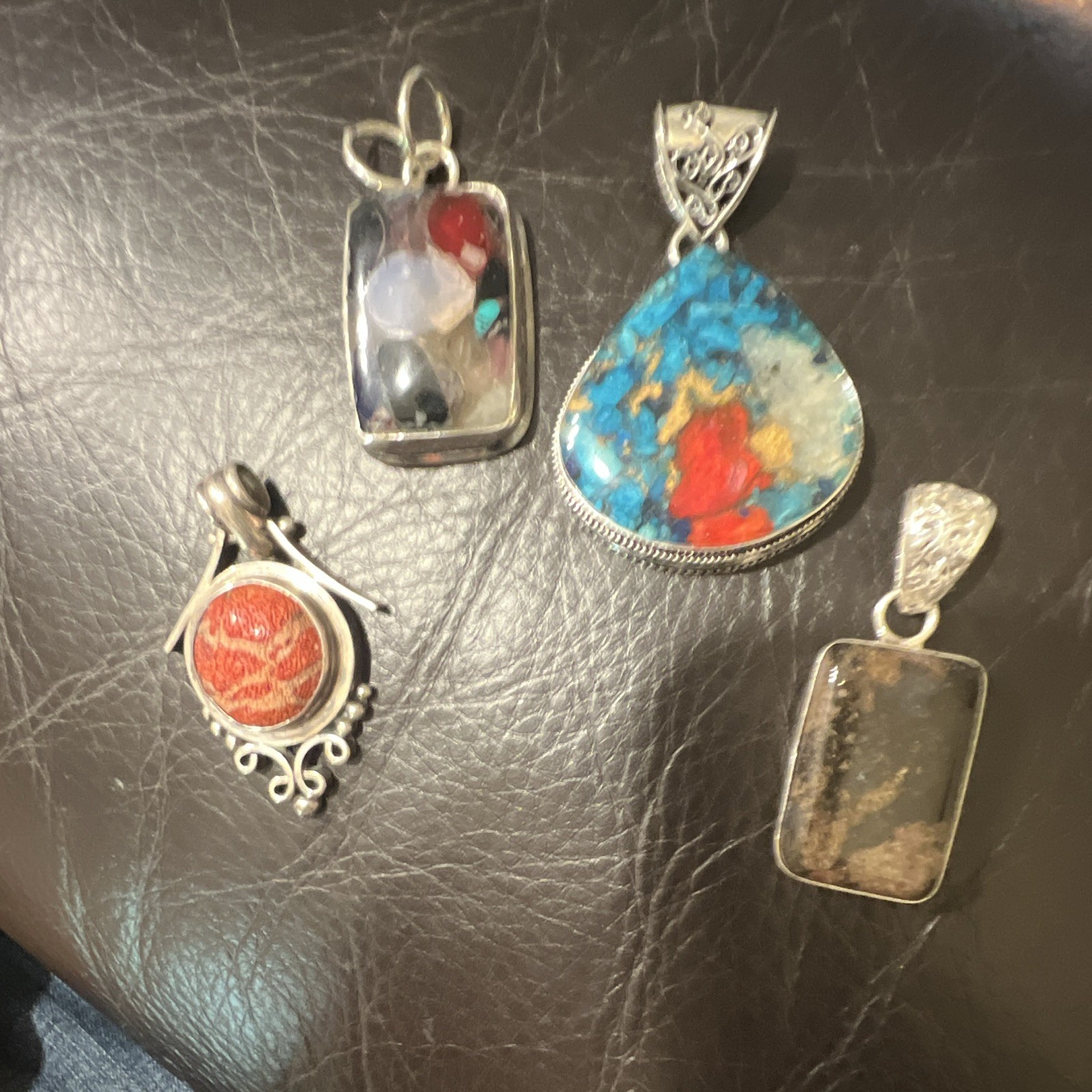 Multiple Pendants, Colorful, But In Sure Of What They Are made Of.