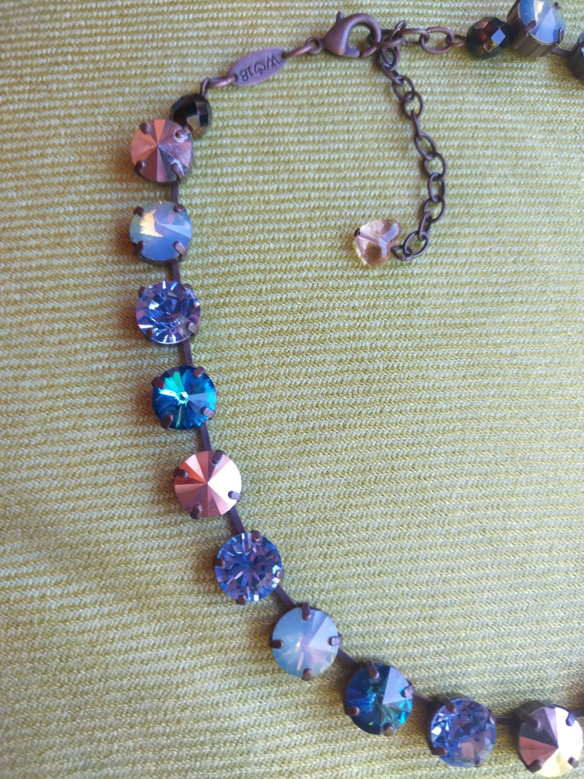 Soulful blue Sabika necklace features violet, midnight blue, opal, metallic