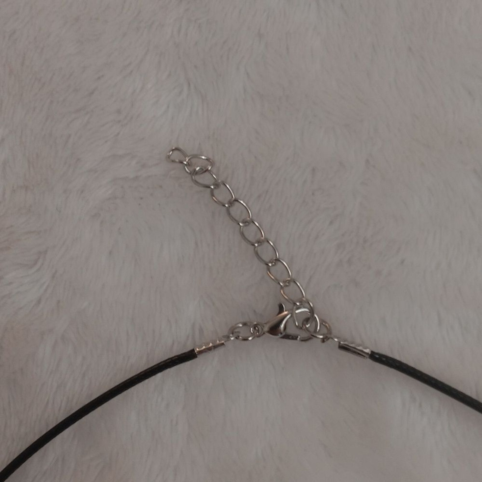 Elegant Black Necklace with Orange Cross Pendant