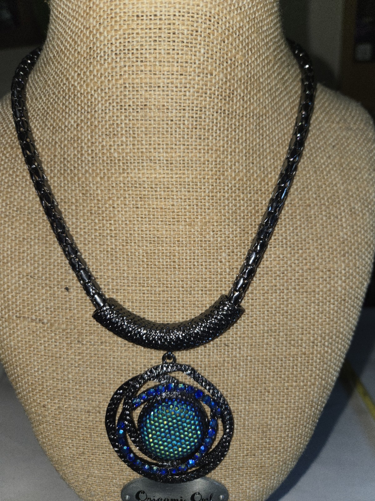 Gunmetal finished Vibrant Green And Blue Style Center Sortounded With Crystal