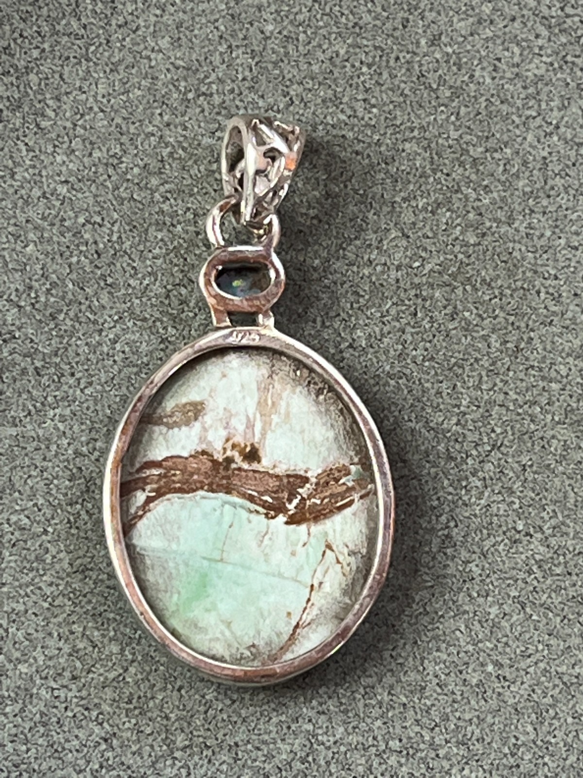 Small Lab Created Opal & Light Blue w Brown Veins Oval Stone in 925 Silver Frame