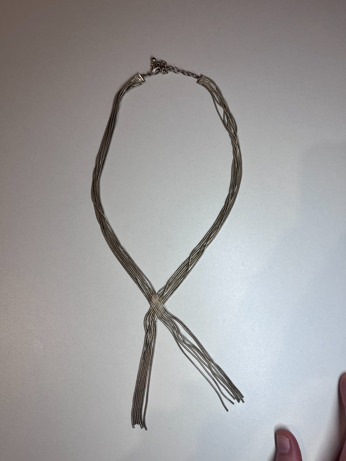MULTI STRAND SILVER TONE CROSS OVER NECKLACE
