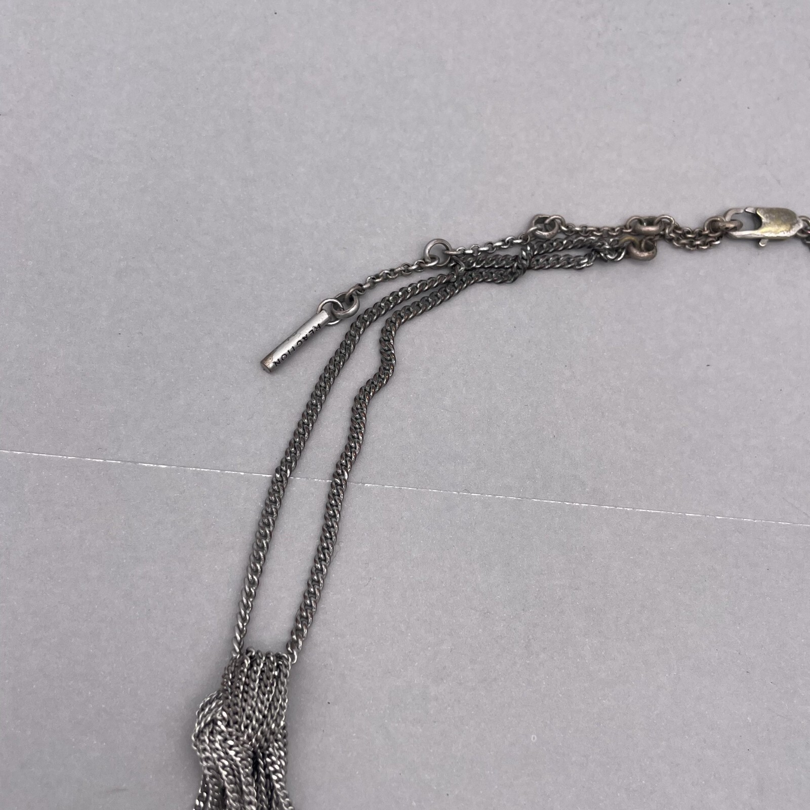Kenneth Cole Reaction Multi Chain Tassel Necklace Silver and Tone 22 to 27 In