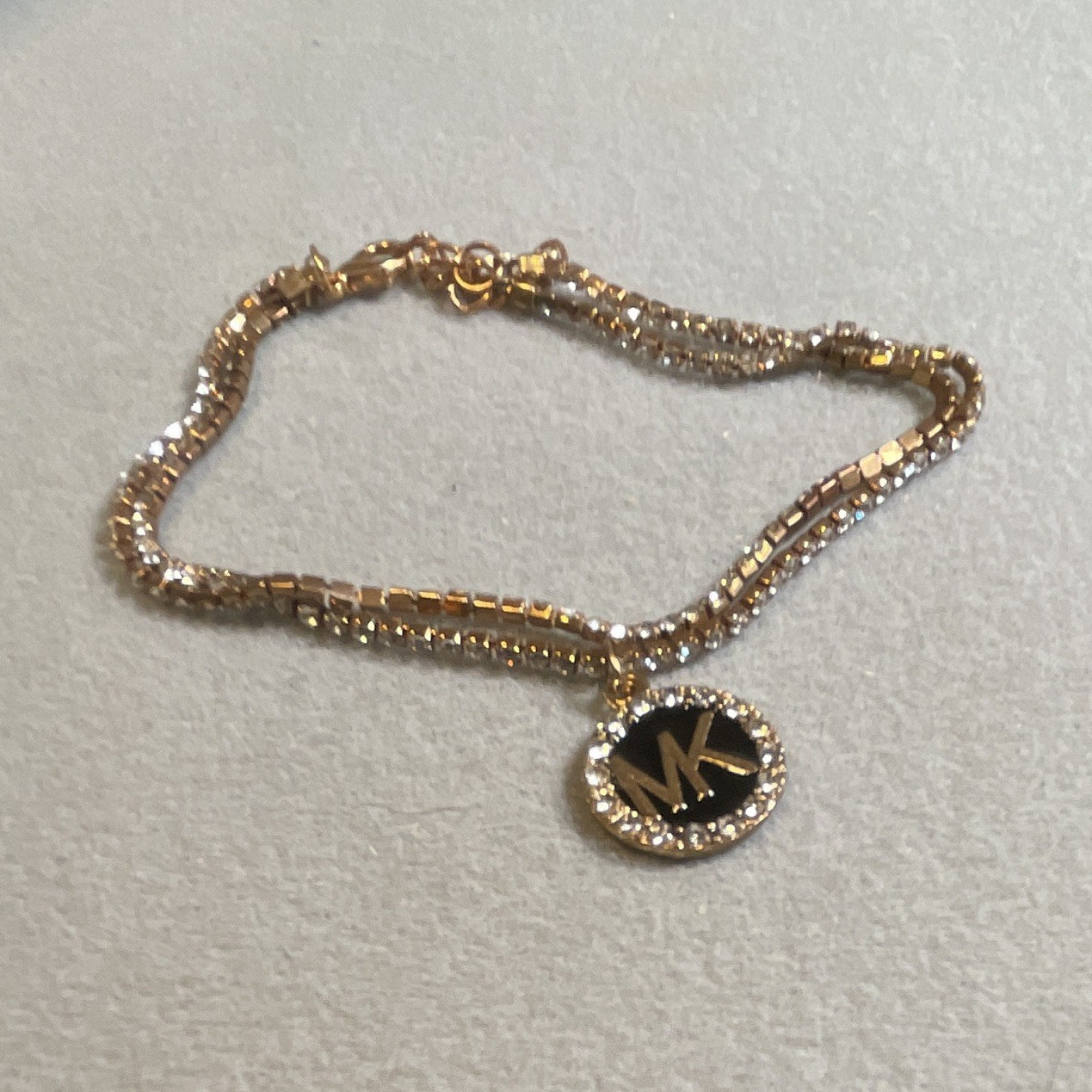 Michael Kors Gold Tone Pavé Clear Crystal Round Charm Pendant Bracelet Lobster