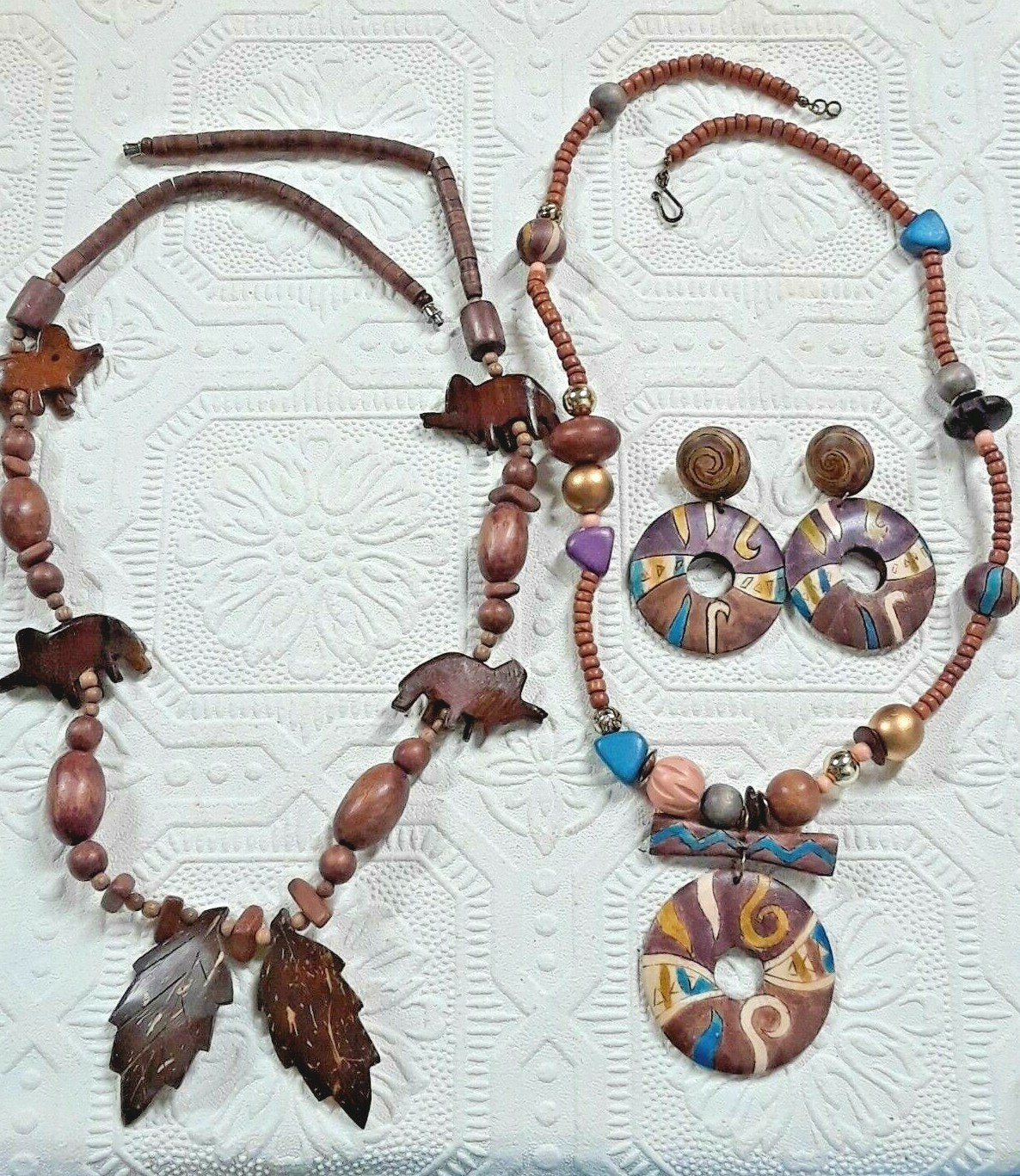 wooden beaded necklaces and one with earrings. elephants, leaves, colorful beads