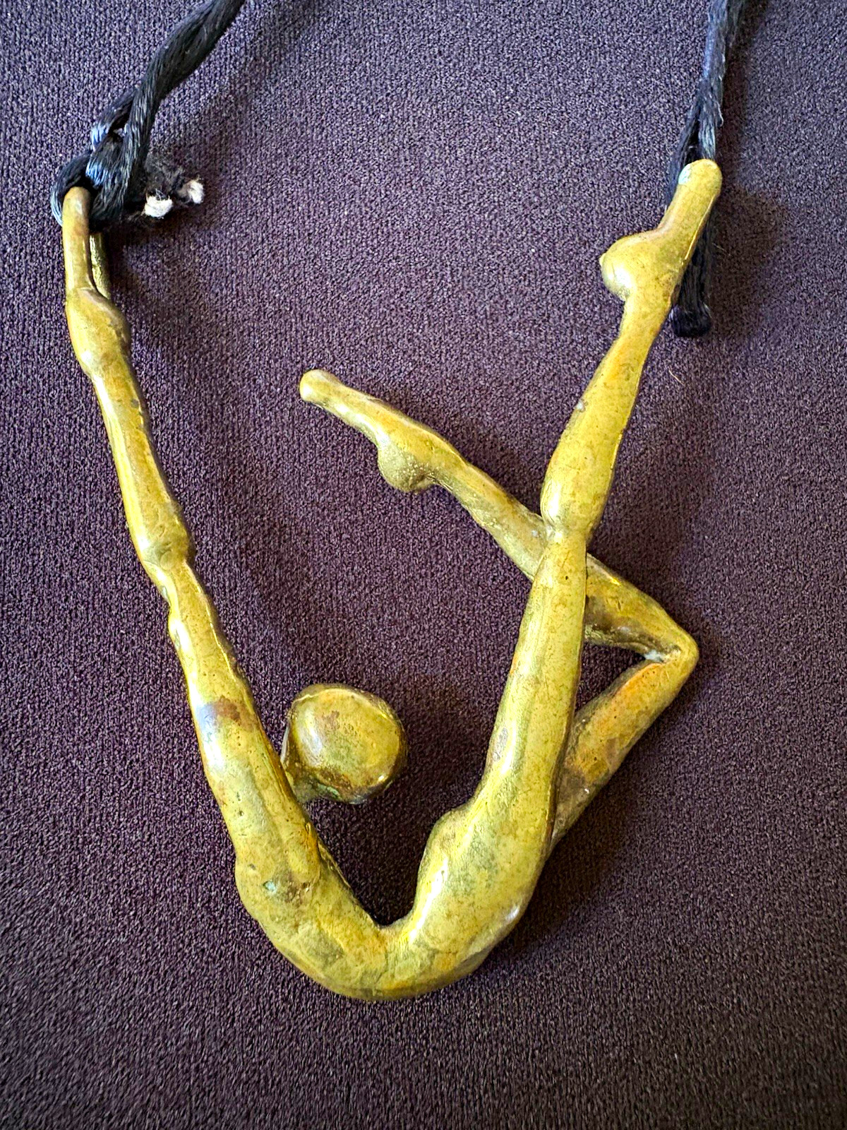 VINTAGE BRASS NUDE DANCER ACROBAT PENDANT ARTISAN BRUTALIST ROPE NECKLACE