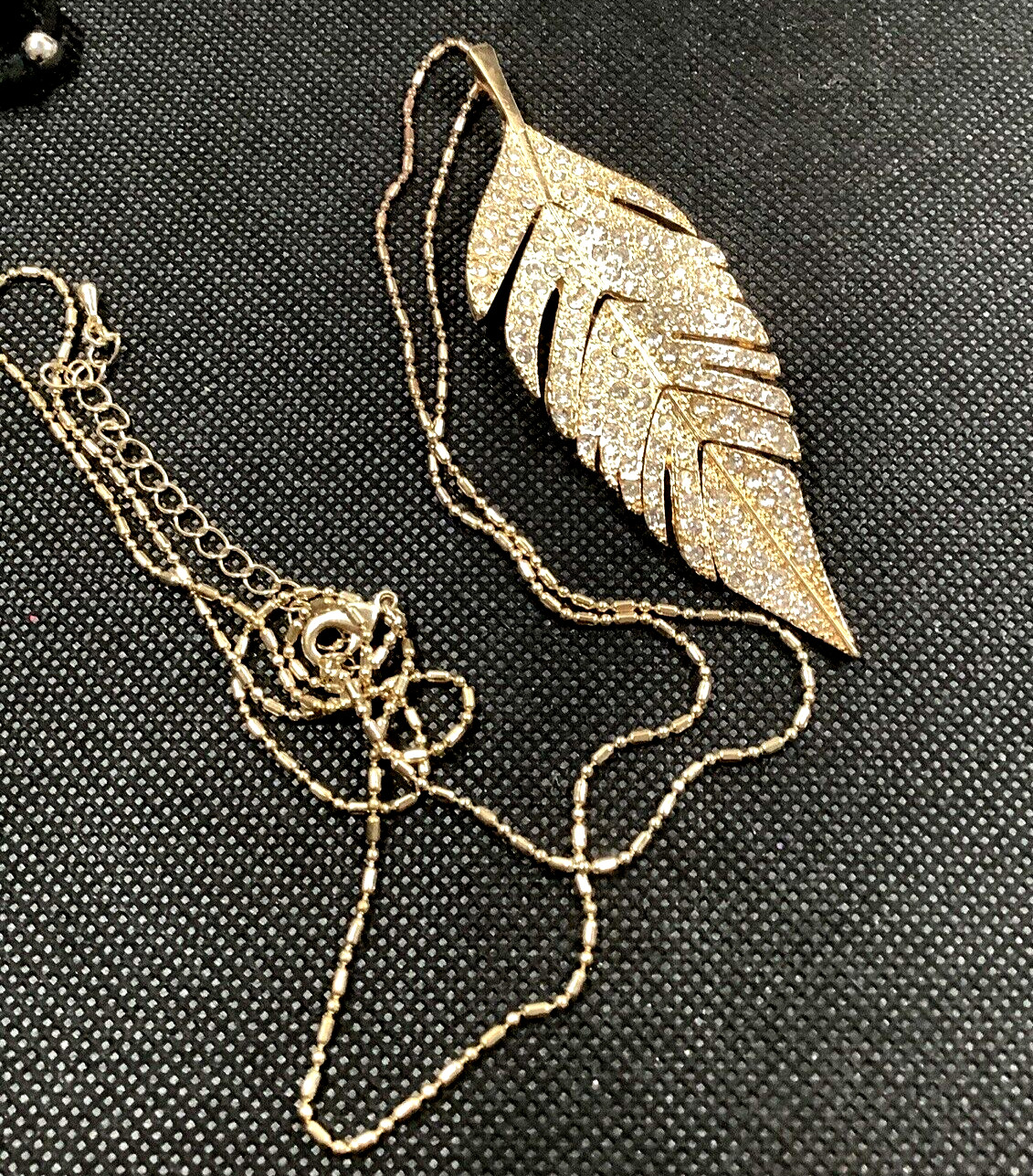 Gold Tone Dash Dot 34′” Chain 3.75″ Feather Pendant Pave Articulated