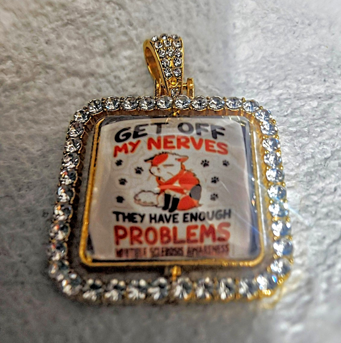Gold Tone Square Pavé Rhinestone Crystal Pendant Charm, M.S. Awareness “GET OFF”