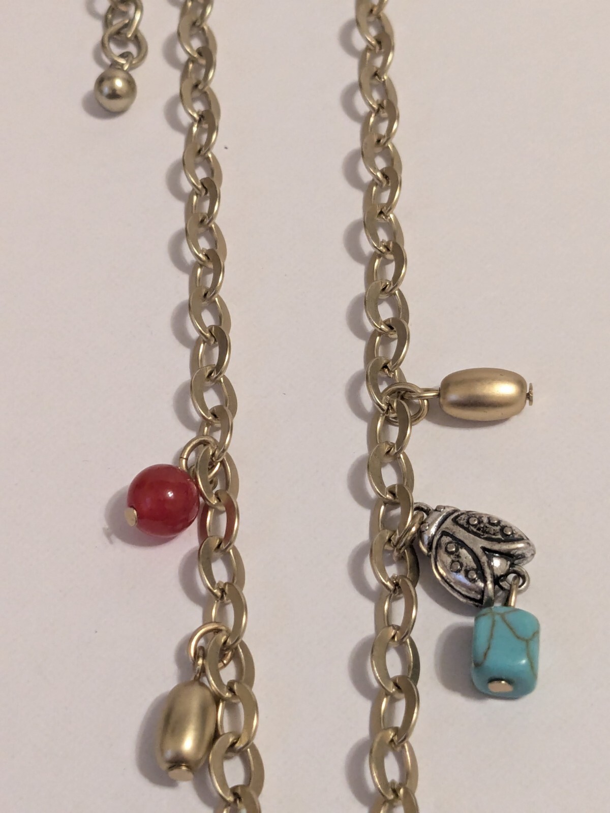 Chico’s Gold Tone Charm Heart Necklace With Multiple Charms & Beads. 34″. BOHO