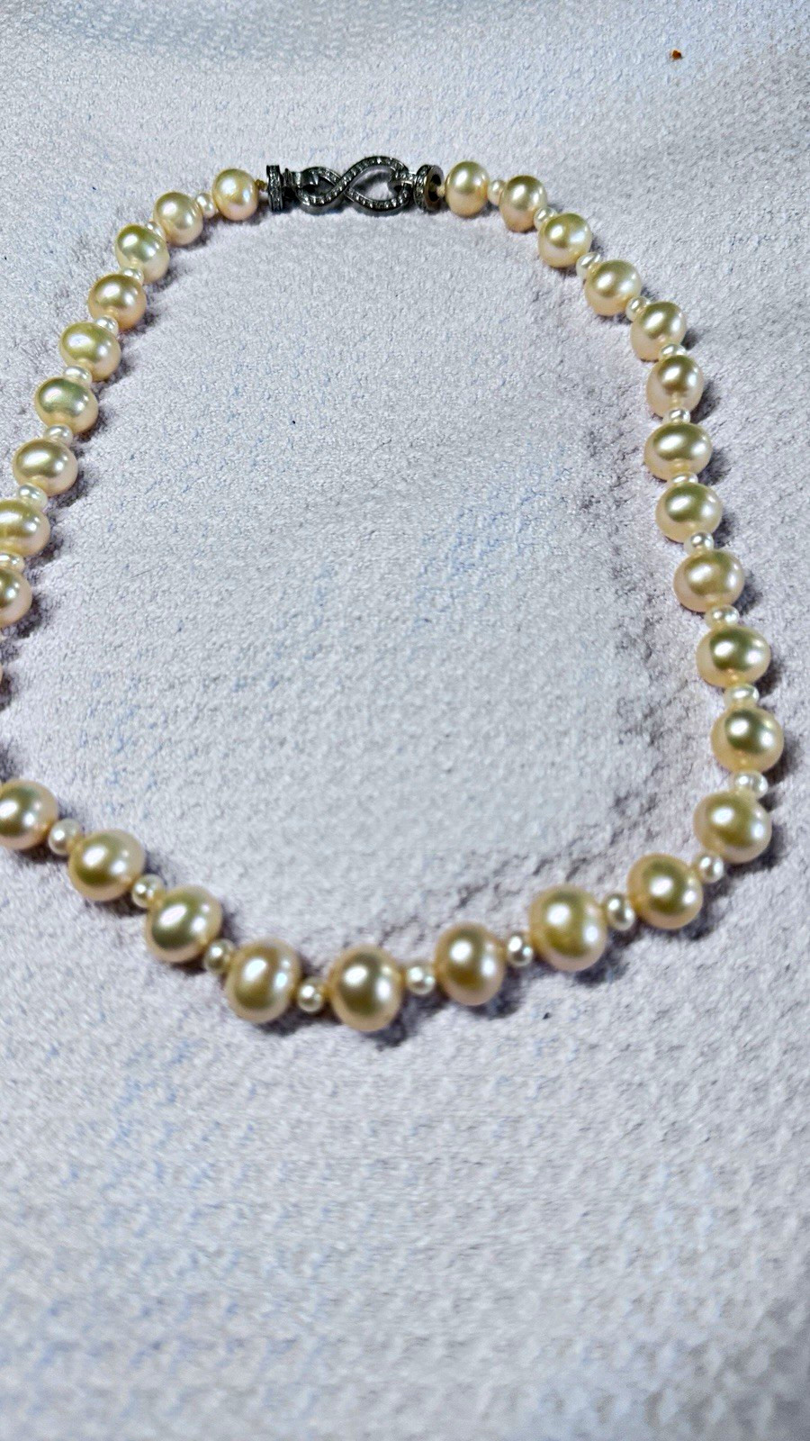 High-quality freshwater pearls with natural aurora luster. (11mm–12mm)
