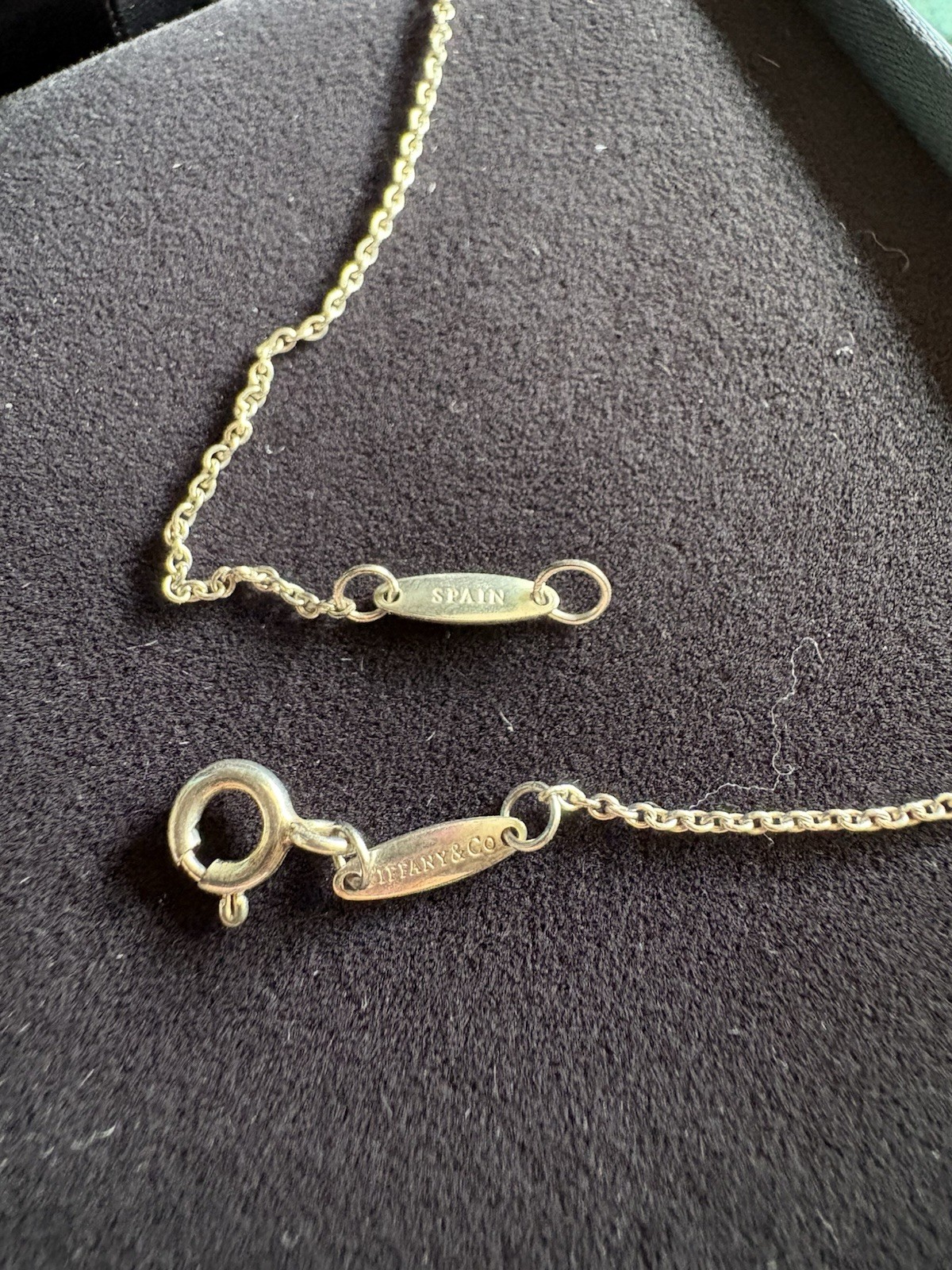 Authentic Tiffany & Co. Three round natural diamonds Necklace. NEW