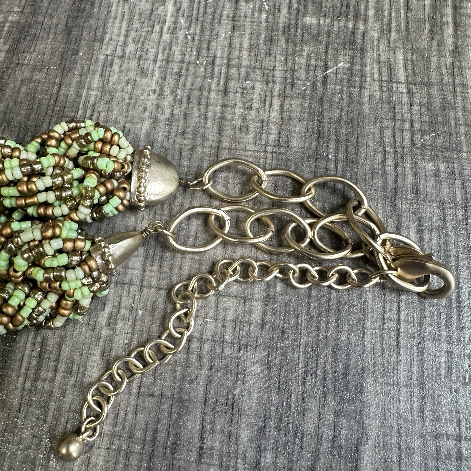 Chico’s light green and golden seed bead multi-strand braided necklace, pre-owne