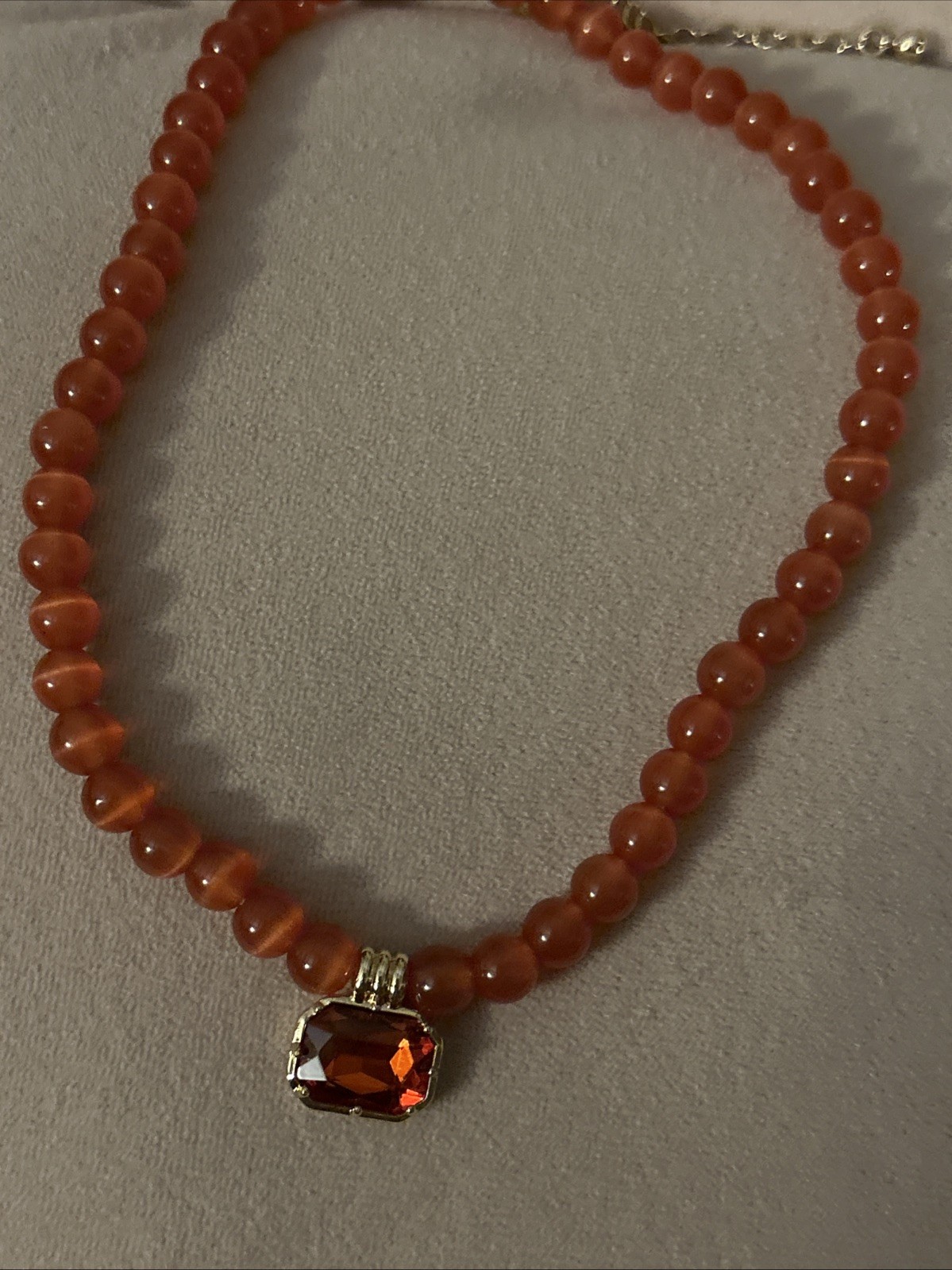 Anthropologie Coral Hued Bead Pendant .