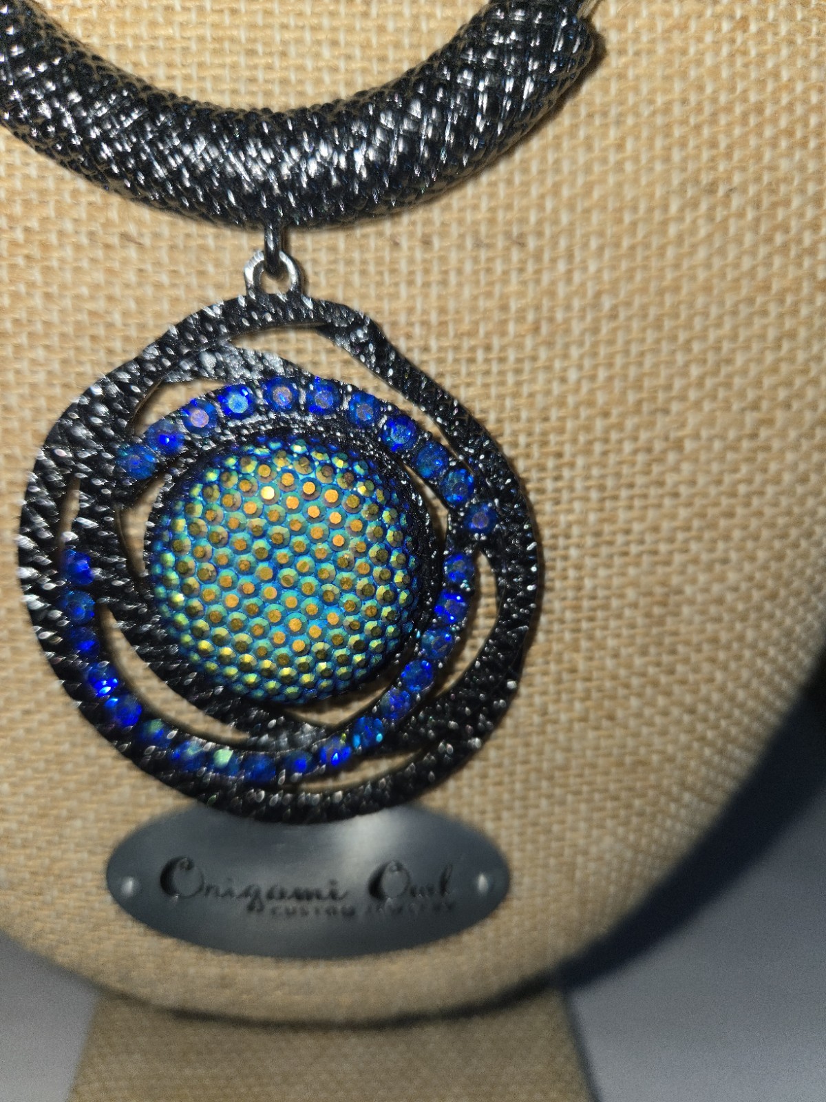 Gunmetal finished Vibrant Green And Blue Style Center Sortounded With Crystal