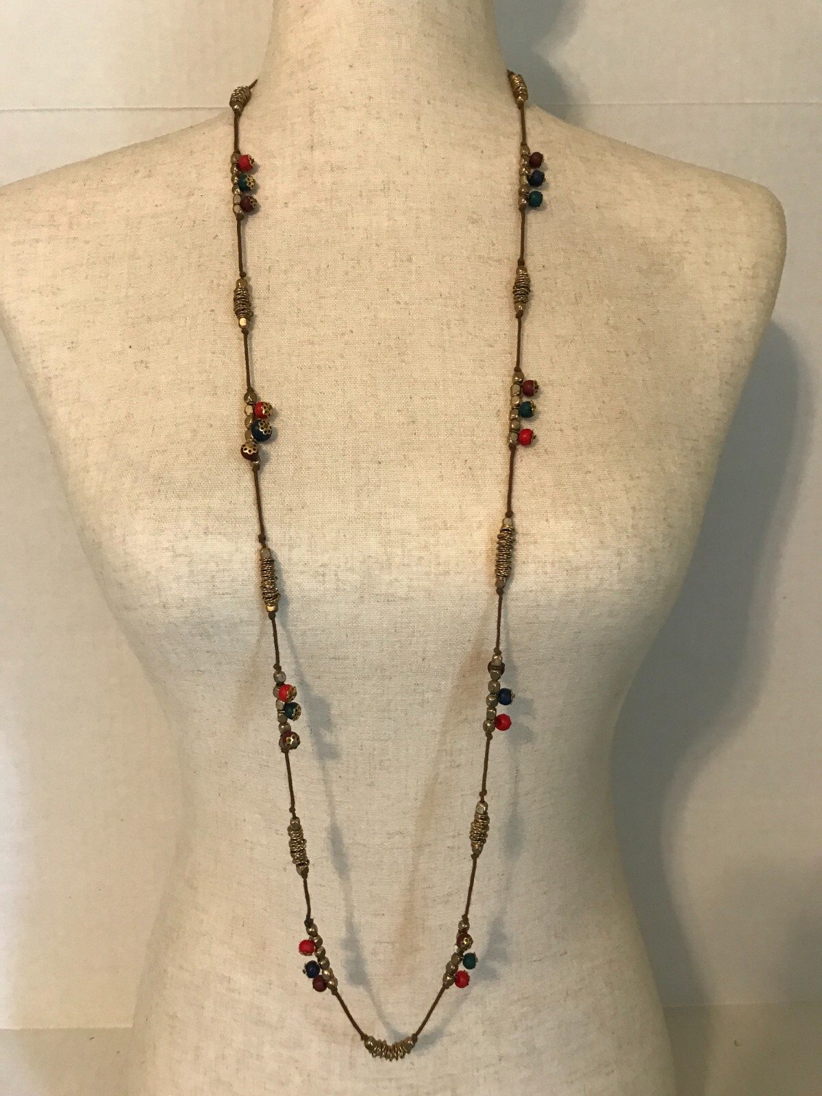 LONG GOLD TONE METAL AND MULTICOLORED PLASTIC BEADED NECKLACE MADE IN INDIA