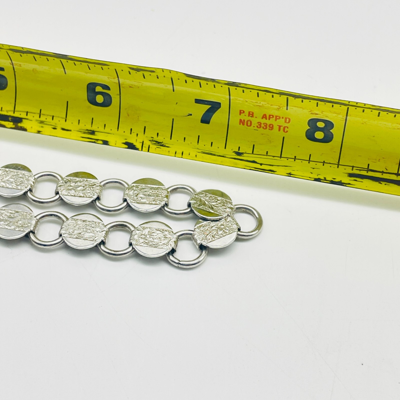 SARAH COVENTRY SAC Etched Necklace Silver Tone Disc Links Flat Lay