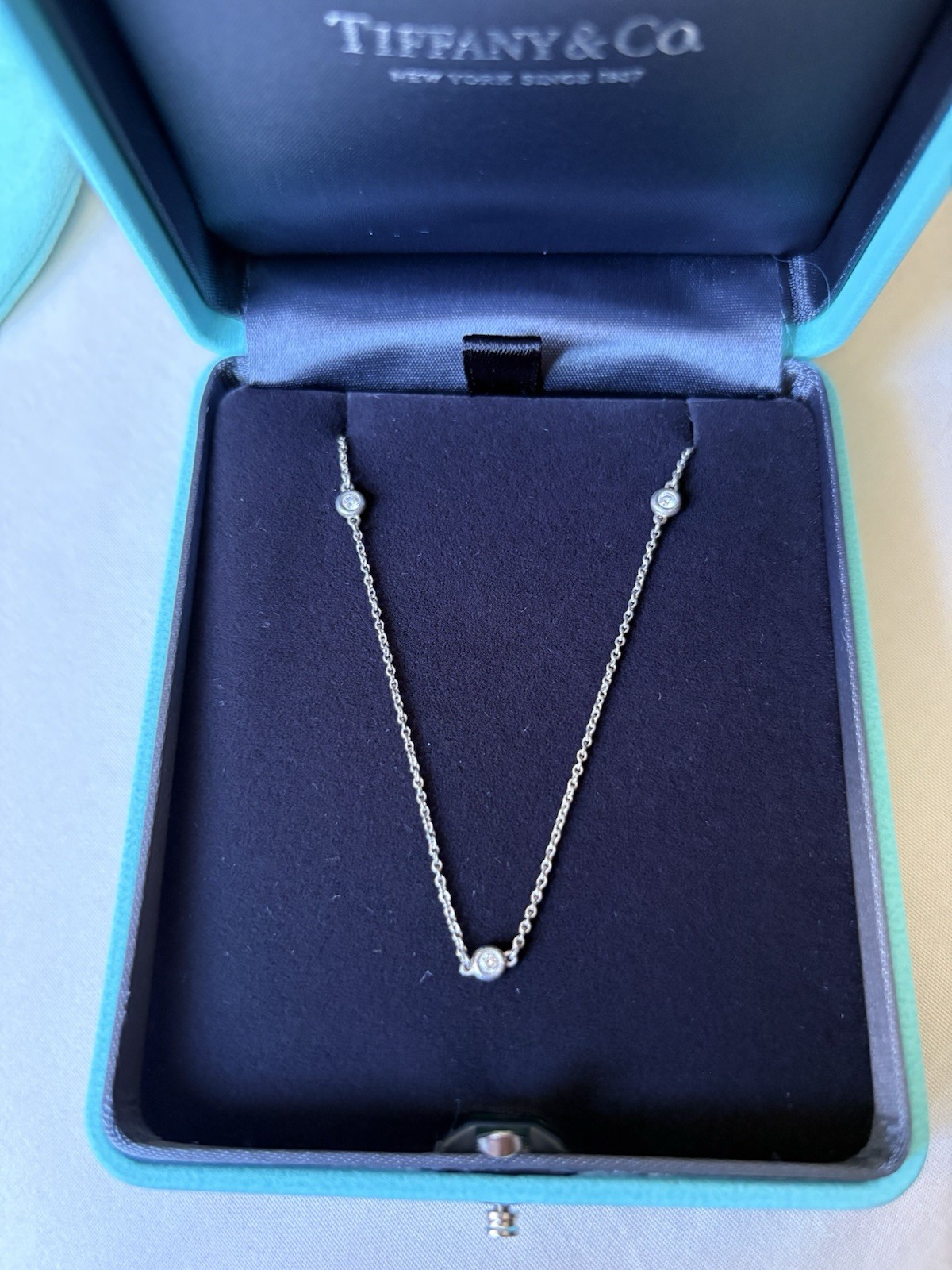 Authentic Tiffany & Co. Three round natural diamonds Necklace. NEW