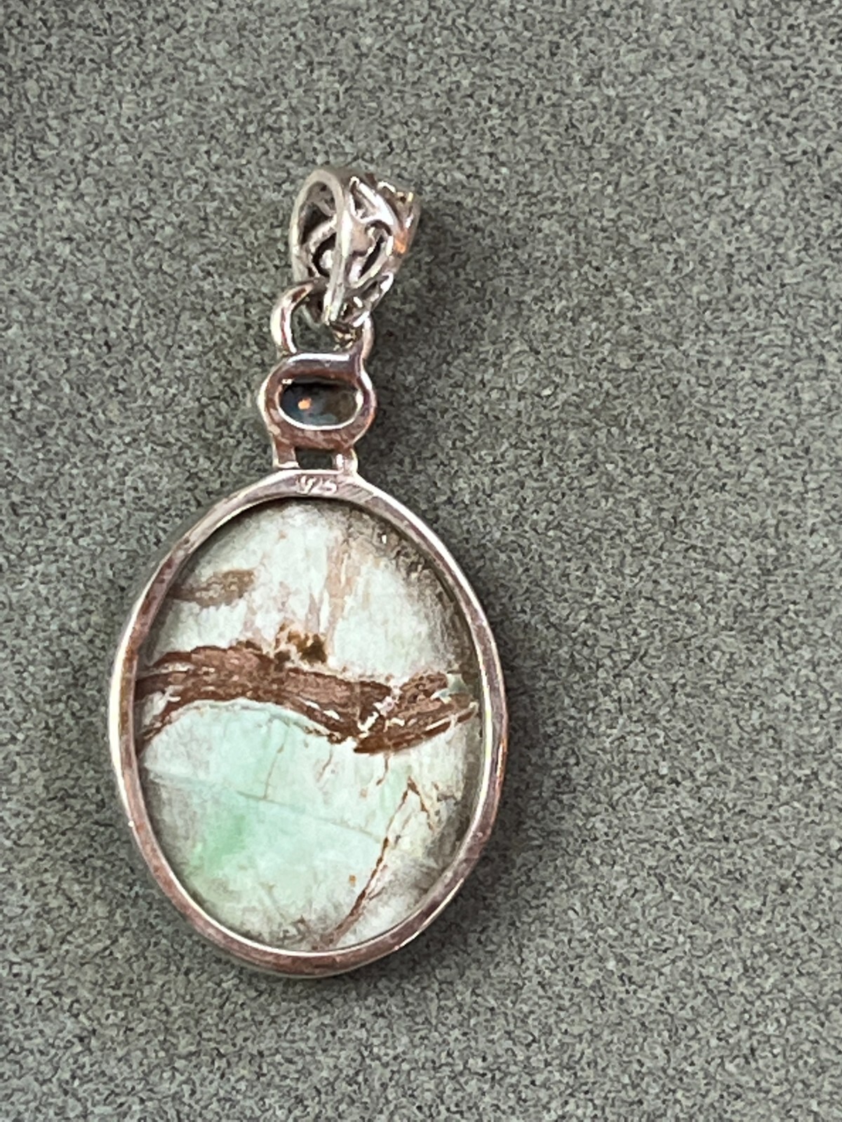 Small Lab Created Opal & Light Blue w Brown Veins Oval Stone in 925 Silver Frame