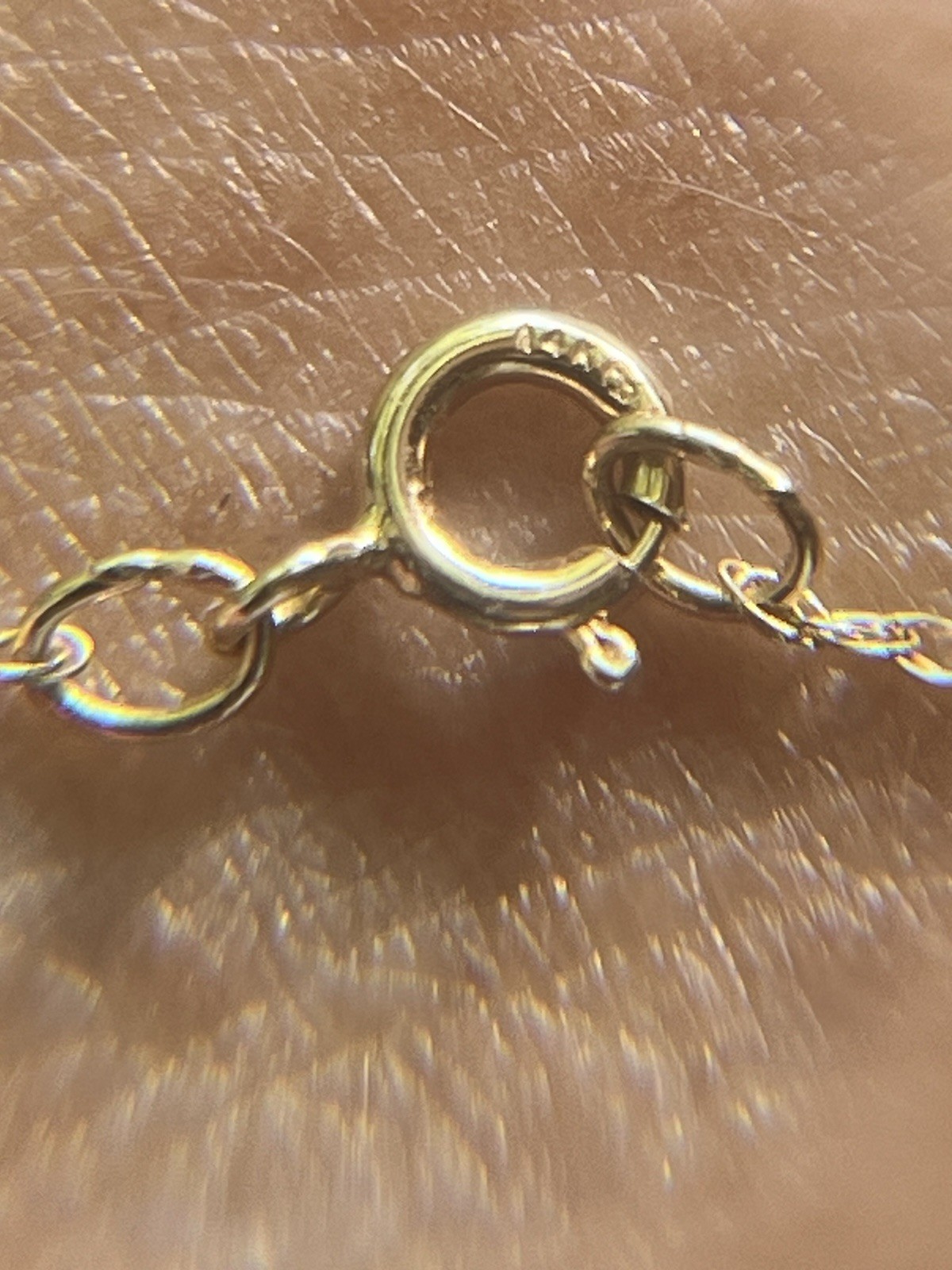 Pear shaped rose quartz set in 14k gold pendant with 14k gold 1.5 mm twist chain