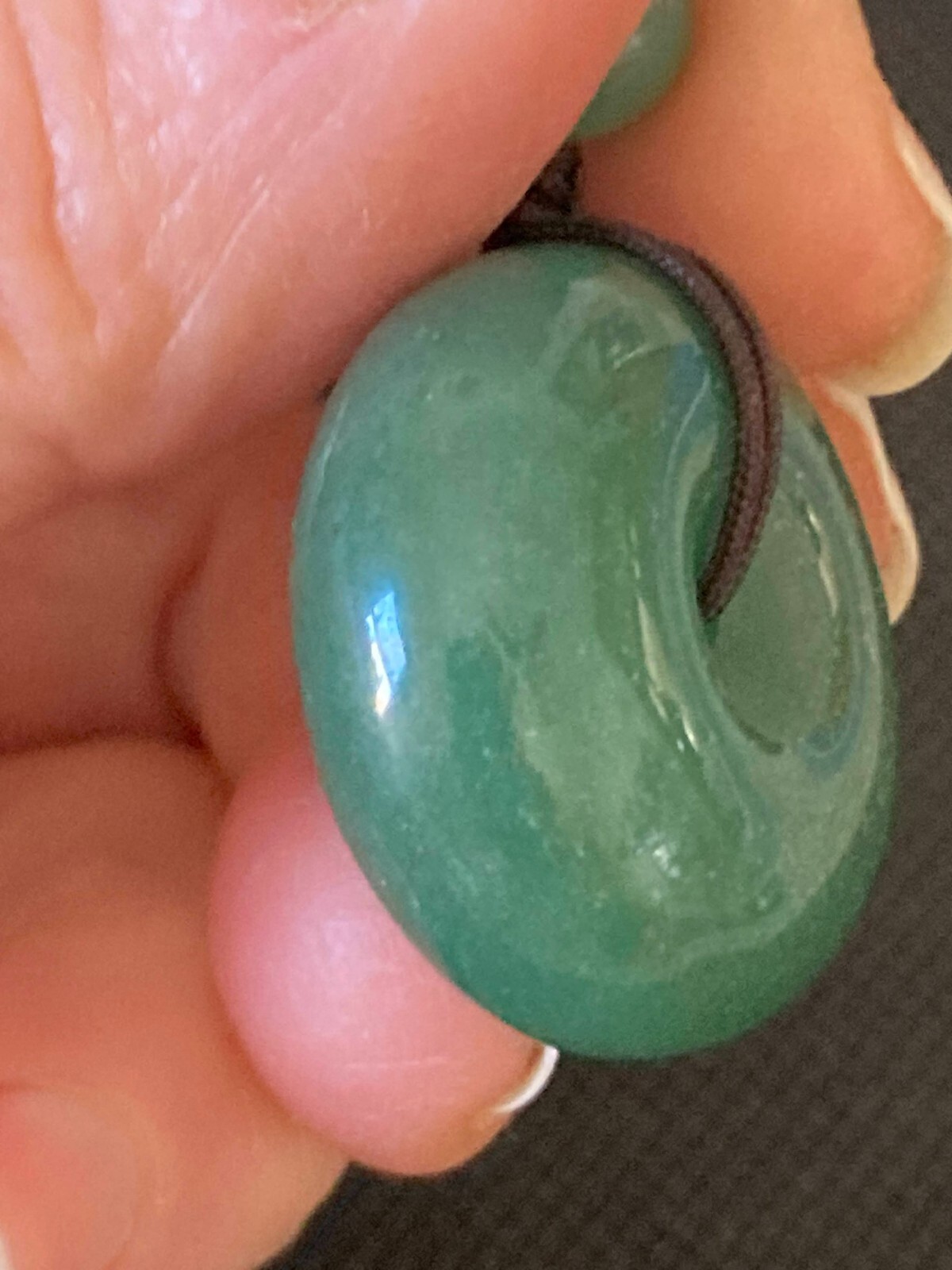 Necklace Carved Green Stone Pendant Circle and 3 stone beads woven with cord