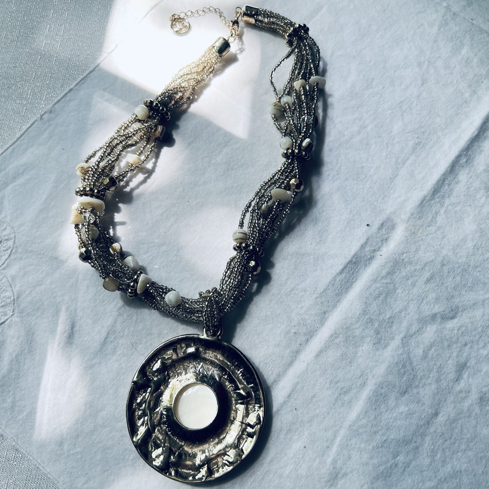 Erica Lyons Multi-strand Beaded Necklace w/Round Silver-tone Shell Pendant, 21”