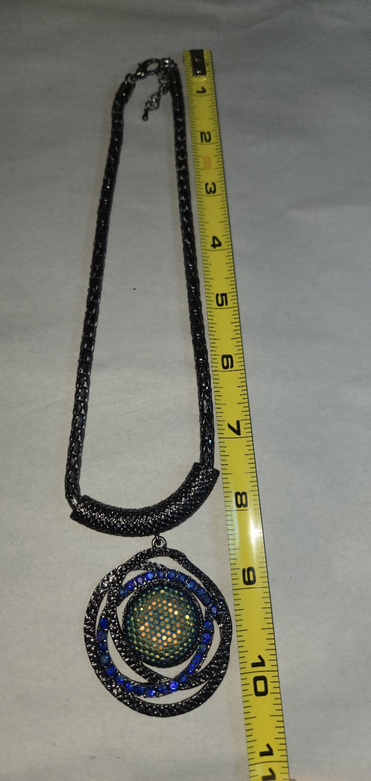 Gunmetal finished Vibrant Green And Blue Style Center Sortounded With Crystal