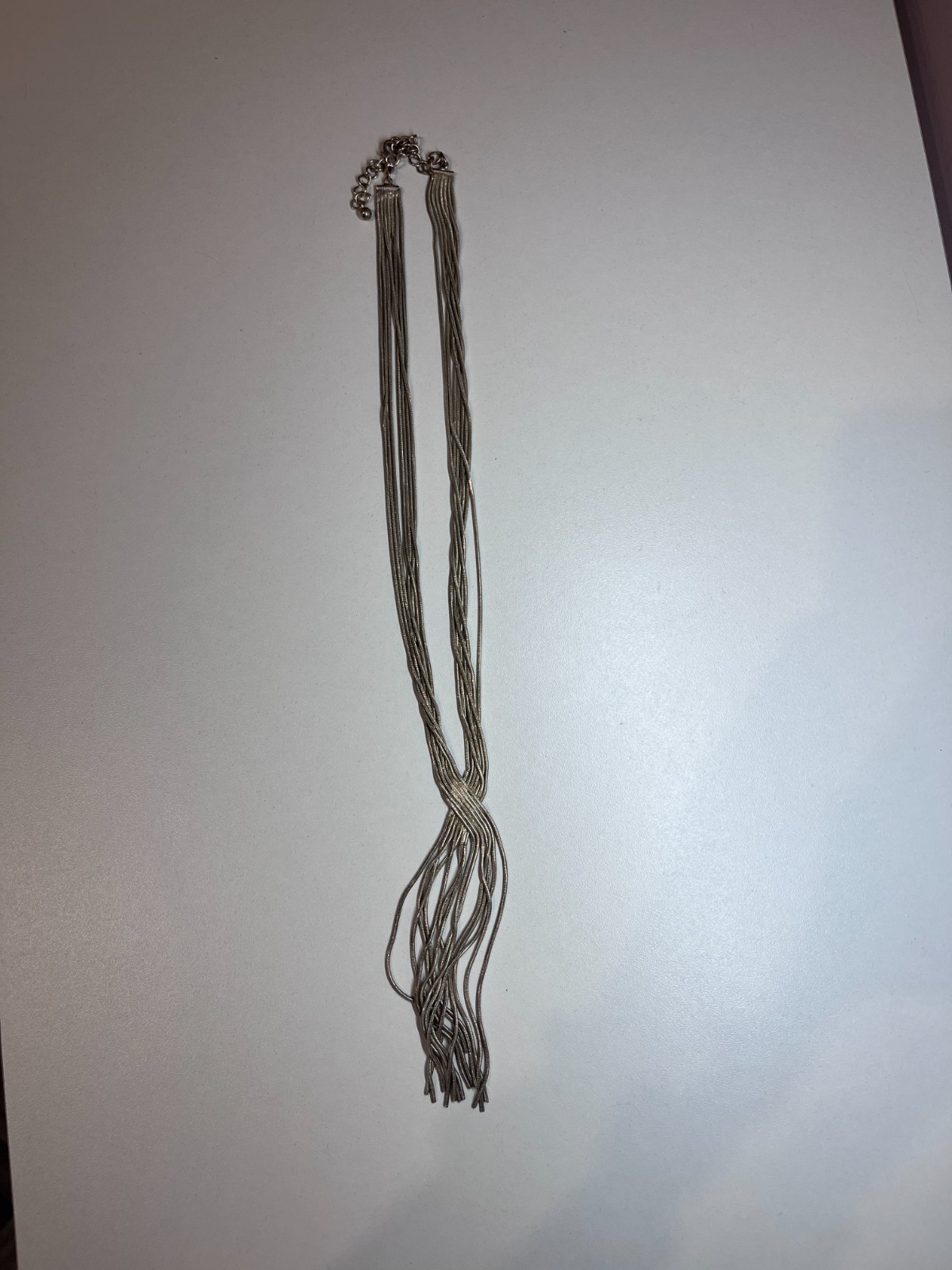 MULTI STRAND SILVER TONE CROSS OVER NECKLACE